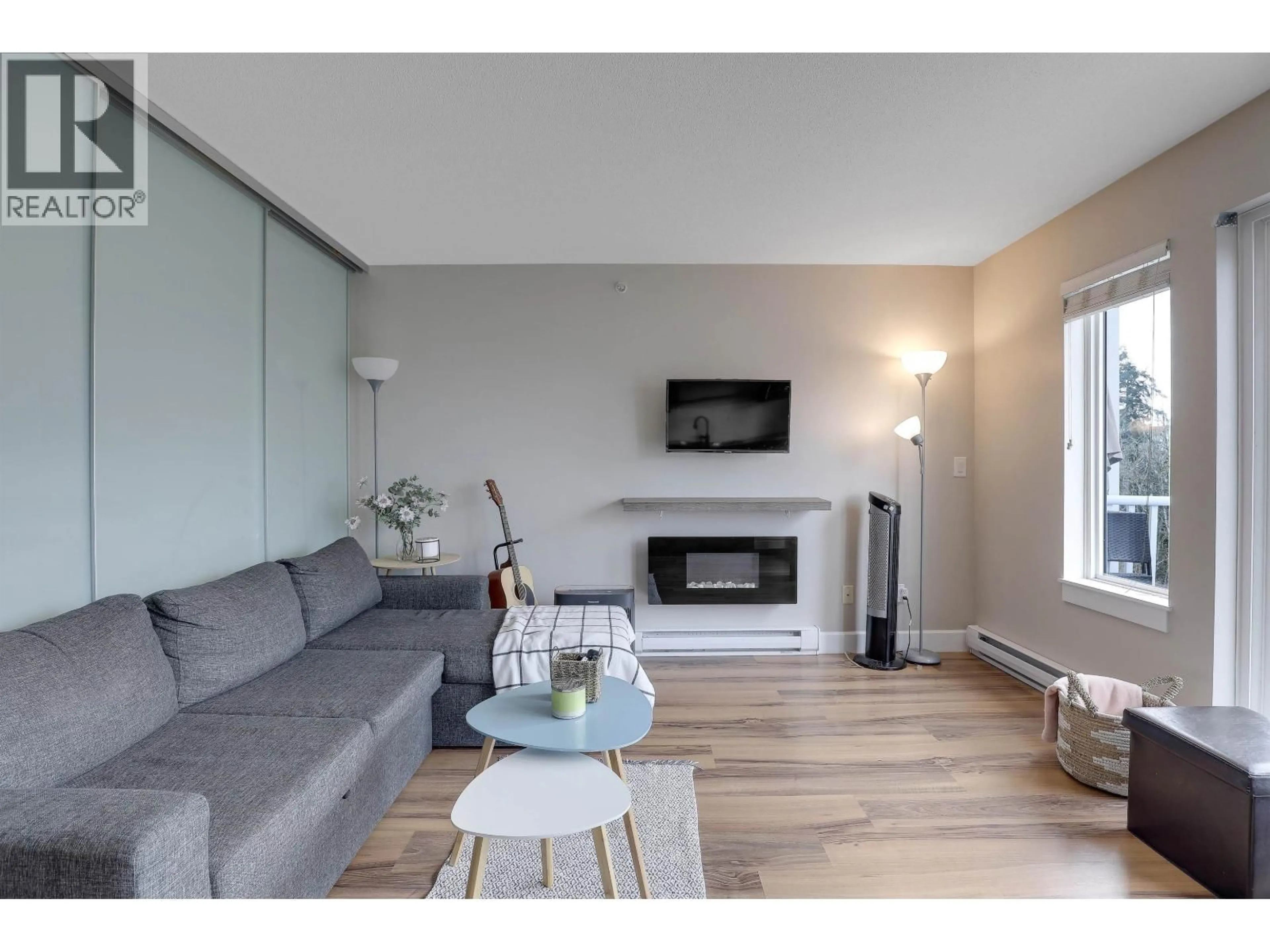 Living room with furniture, wood/laminate floor for 408 - 12283 224TH STREET, Maple Ridge British Columbia V2X8Z3