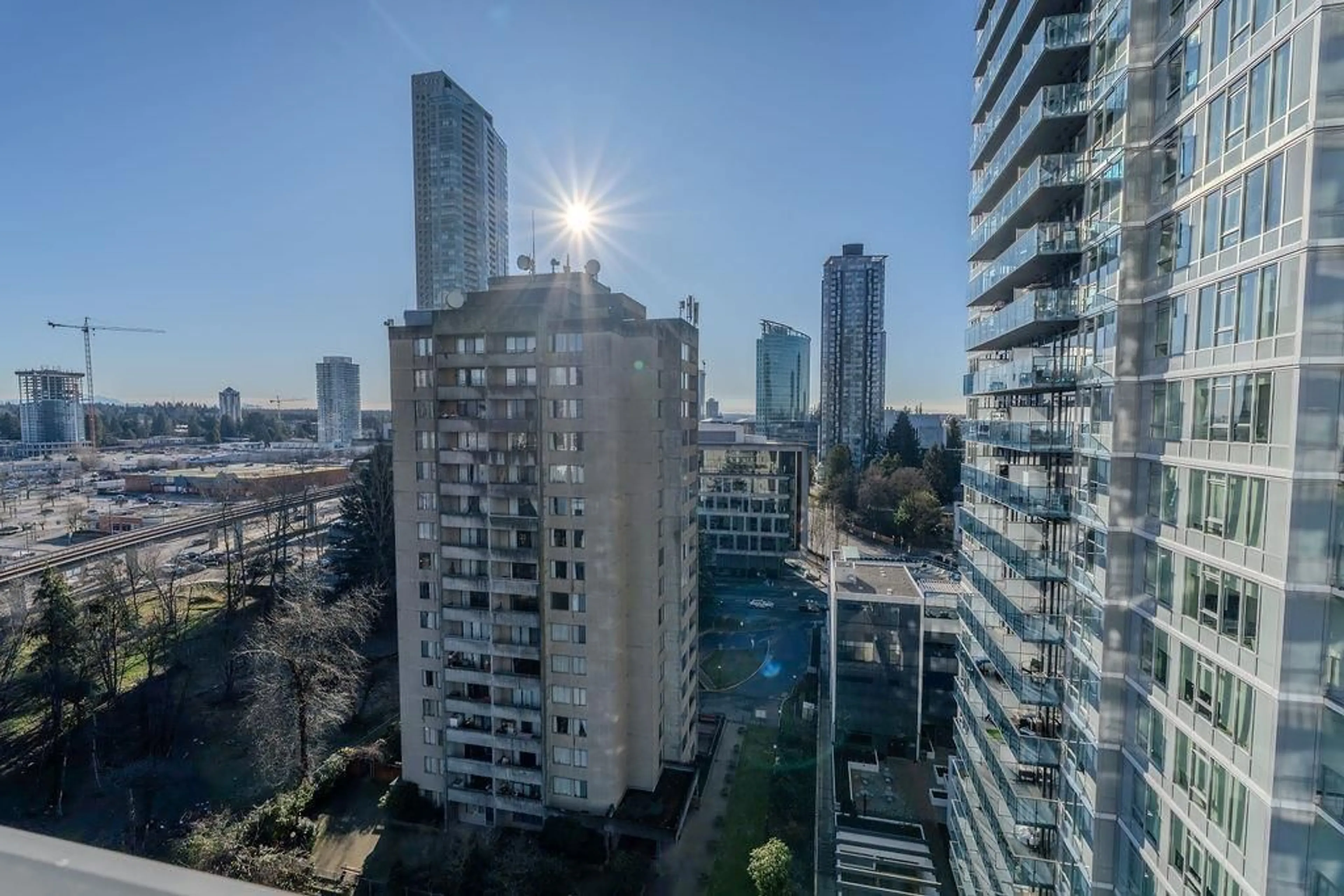 A pic from outside/outdoor area/front of a property/back of a property/a pic from drone, city buildings view from balcony for 1310 - 13428 105, Surrey British Columbia V3T0S6