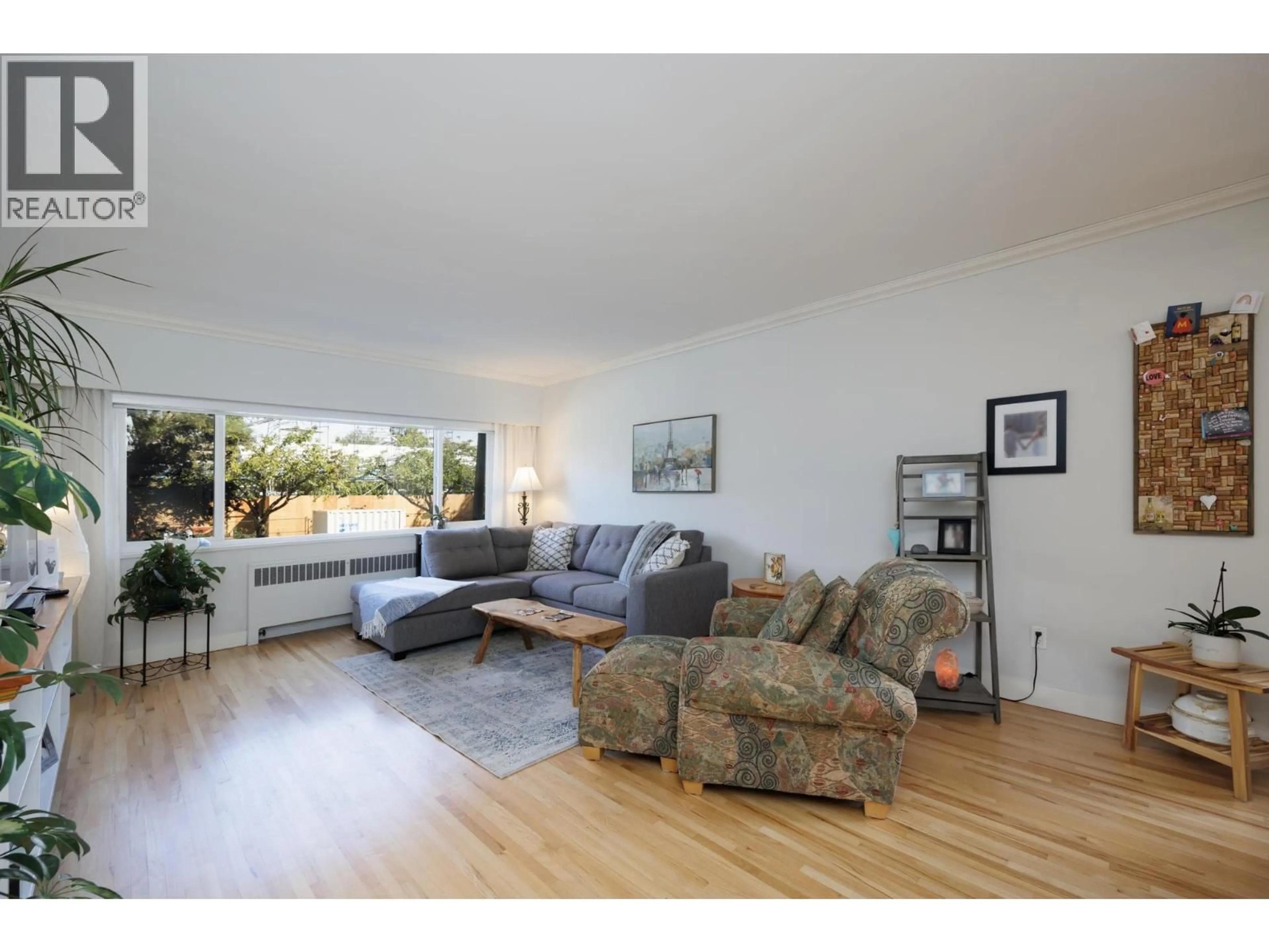 Living room with furniture, wood/laminate floor for 101 - 2146 43RD AVENUE, Vancouver British Columbia V6M2E1