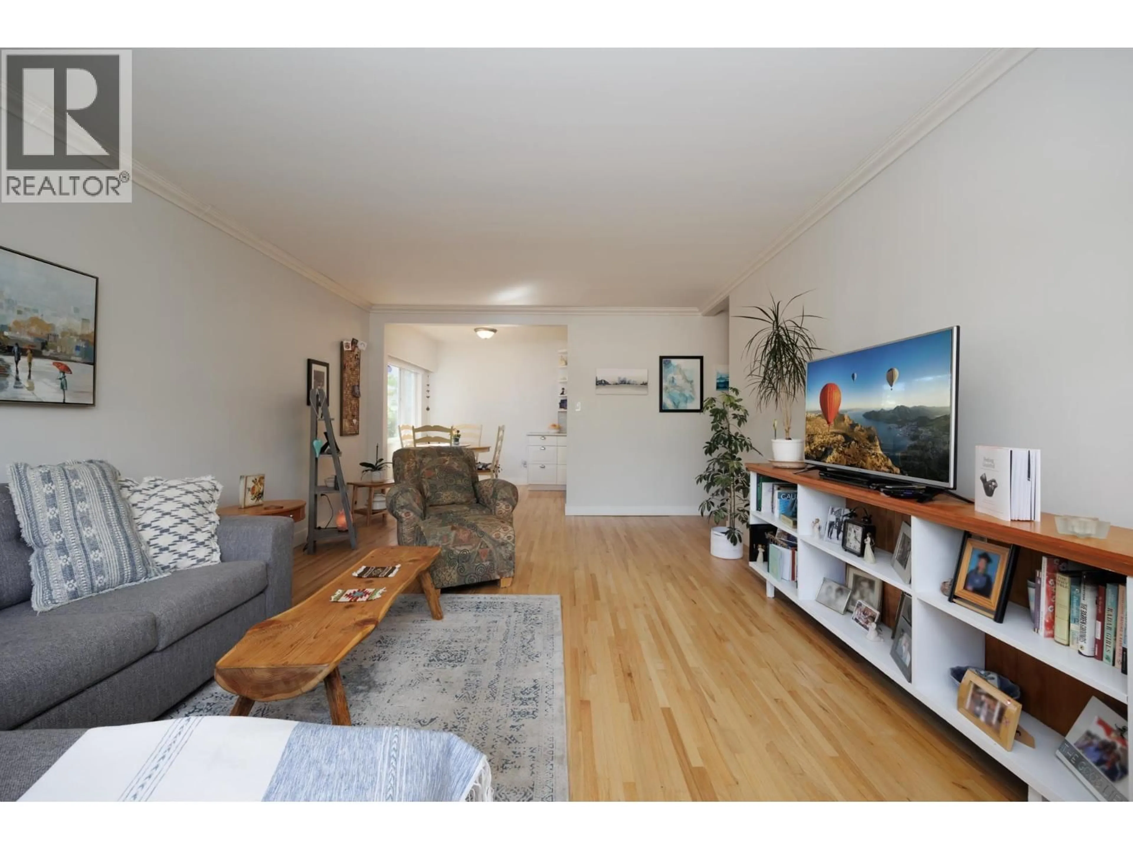 Living room with furniture, wood/laminate floor for 101 - 2146 43RD AVENUE, Vancouver British Columbia V6M2E1