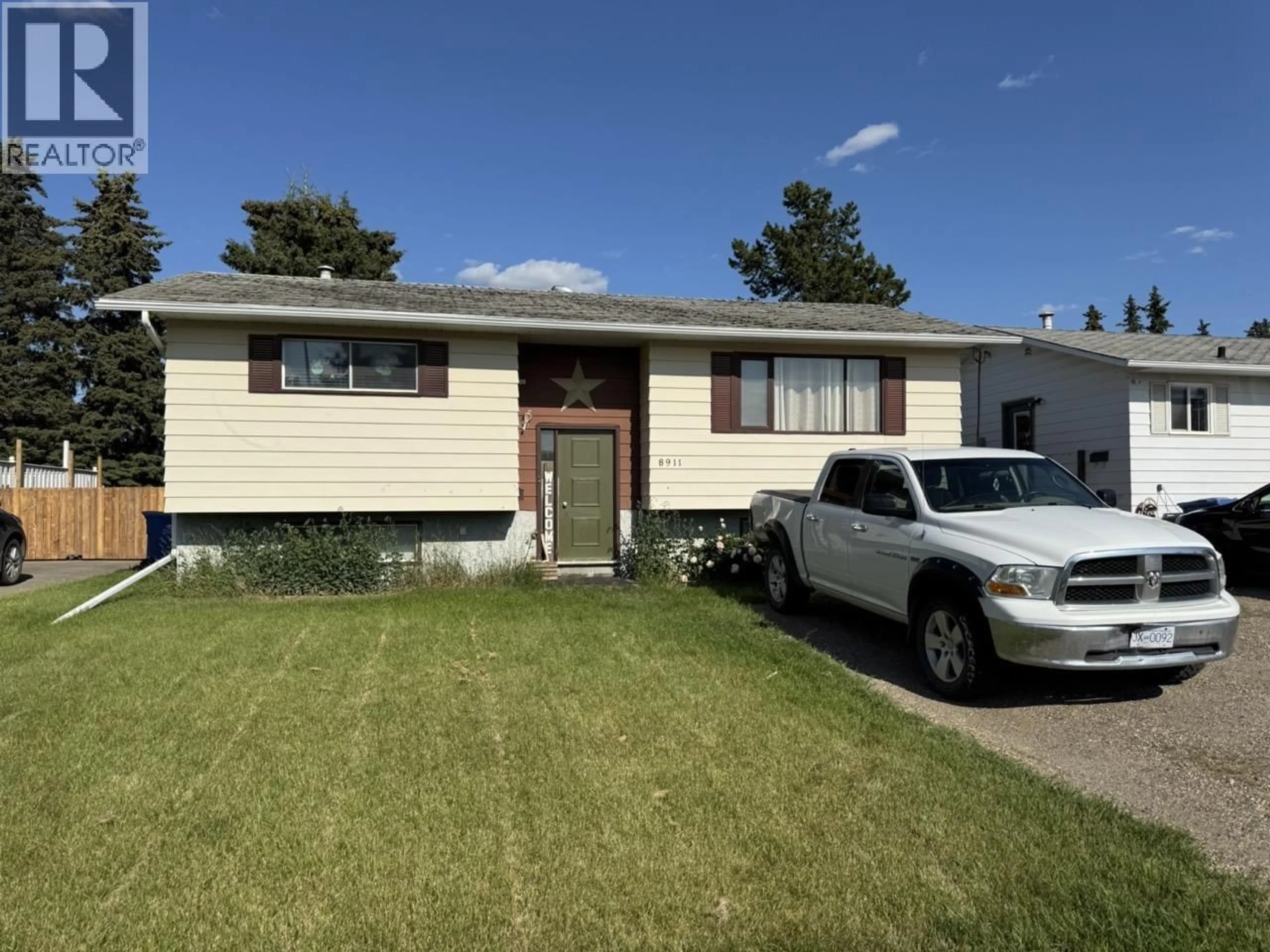 Home with vinyl exterior material, street for 8911 91 STREET, Fort St. John British Columbia V1J4T4