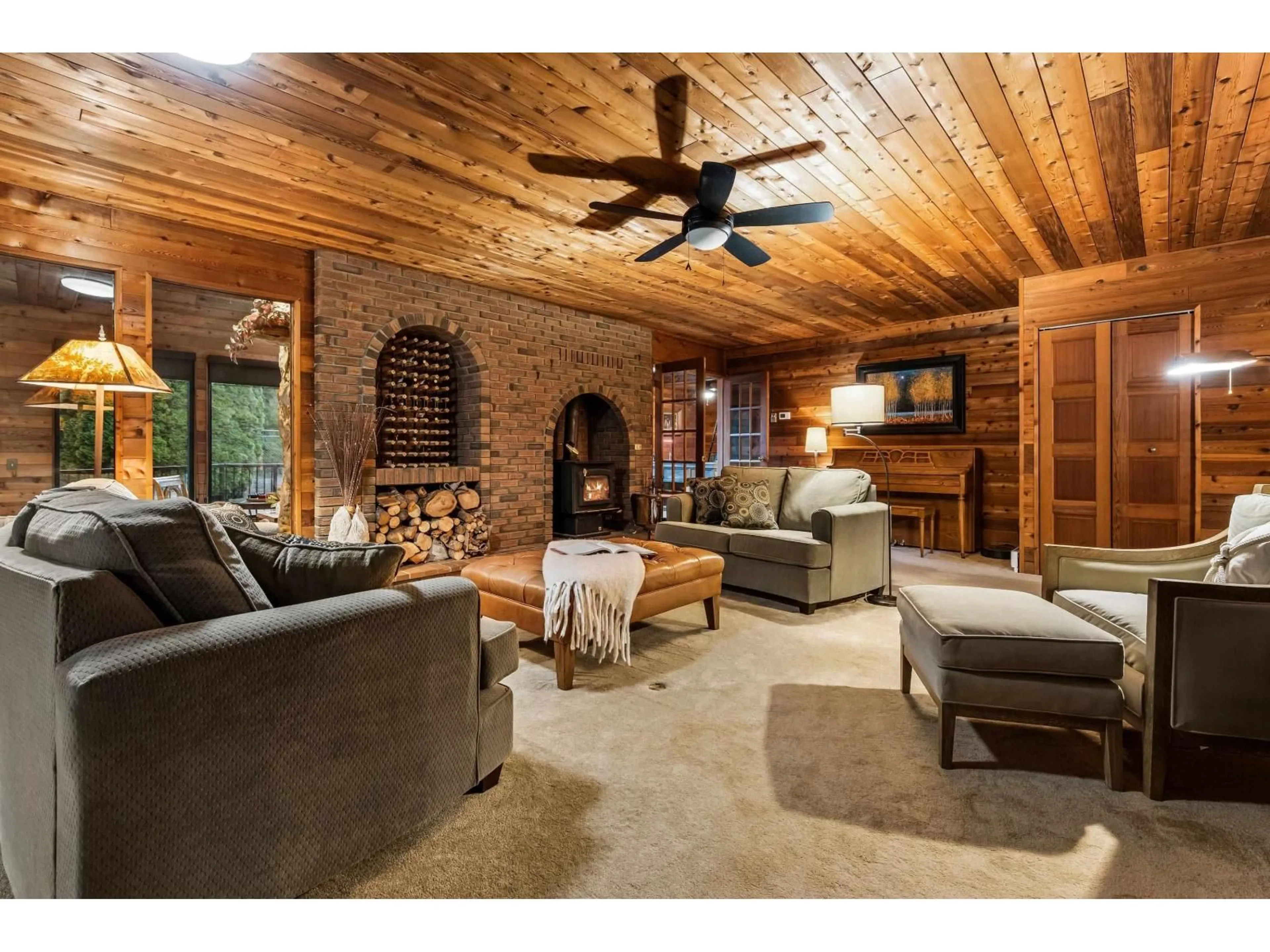Living room with furniture, wood/laminate floor for 43705 WATT ROAD, Cultus Lake British Columbia V2R4X9
