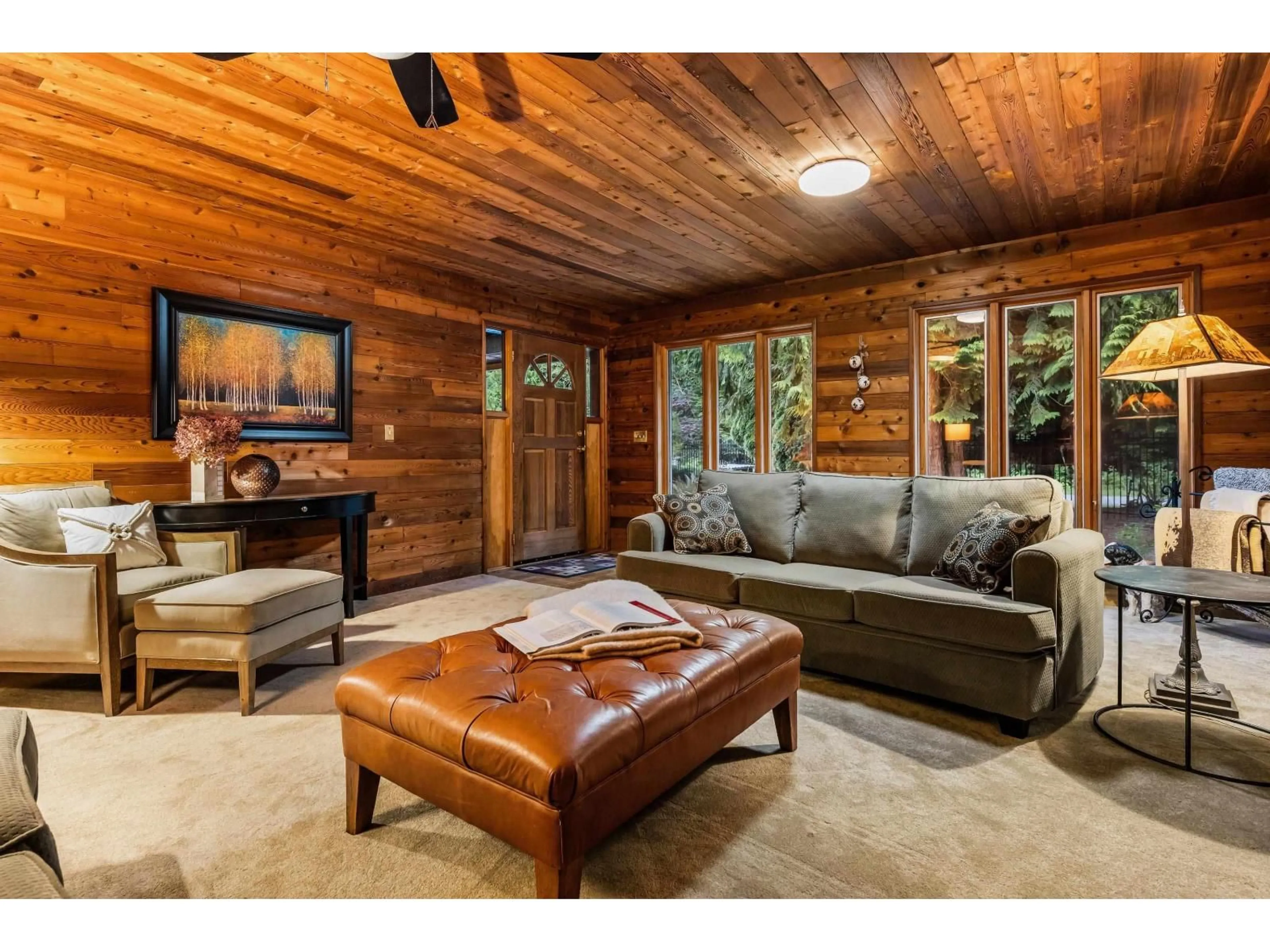 Living room with furniture, wood/laminate floor for 43705 WATT ROAD, Cultus Lake British Columbia V2R4X9
