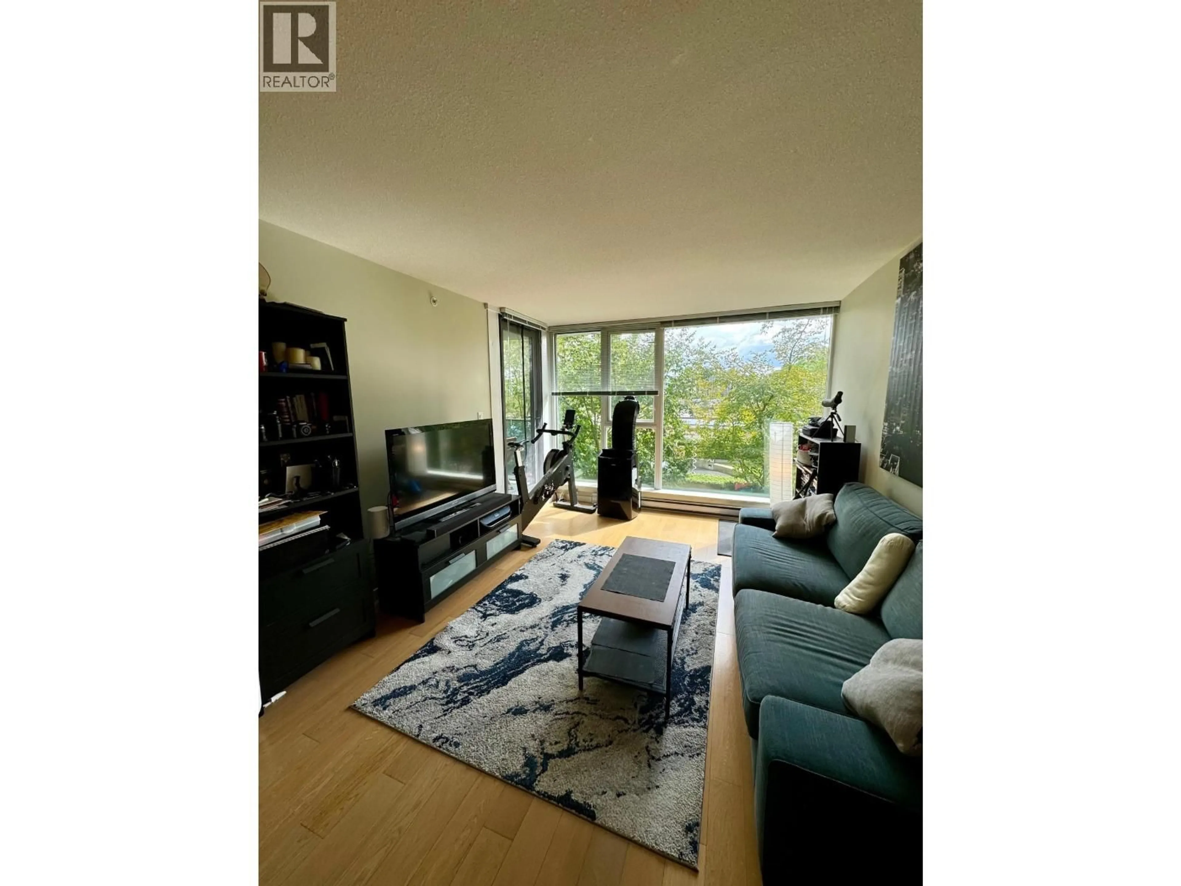 Living room with furniture, wood/laminate floor for 609 - 7117 ELMBRIDGE WAY, Richmond British Columbia V6X0J2