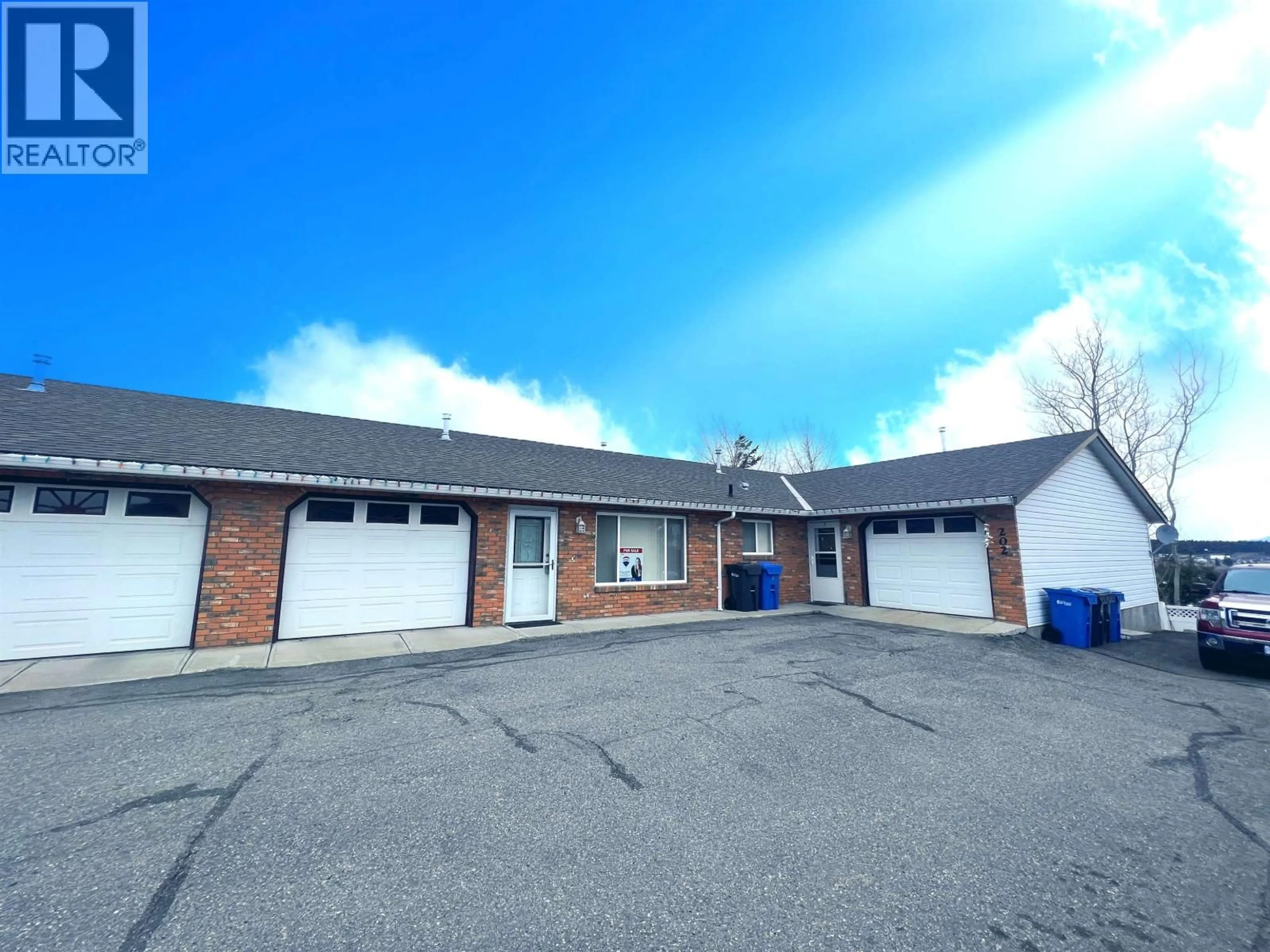 A pic from outside/outdoor area/front of a property/back of a property/a pic from drone, building for 5 - 202 8TH STREET, 100 Mile House British Columbia V0K2E0