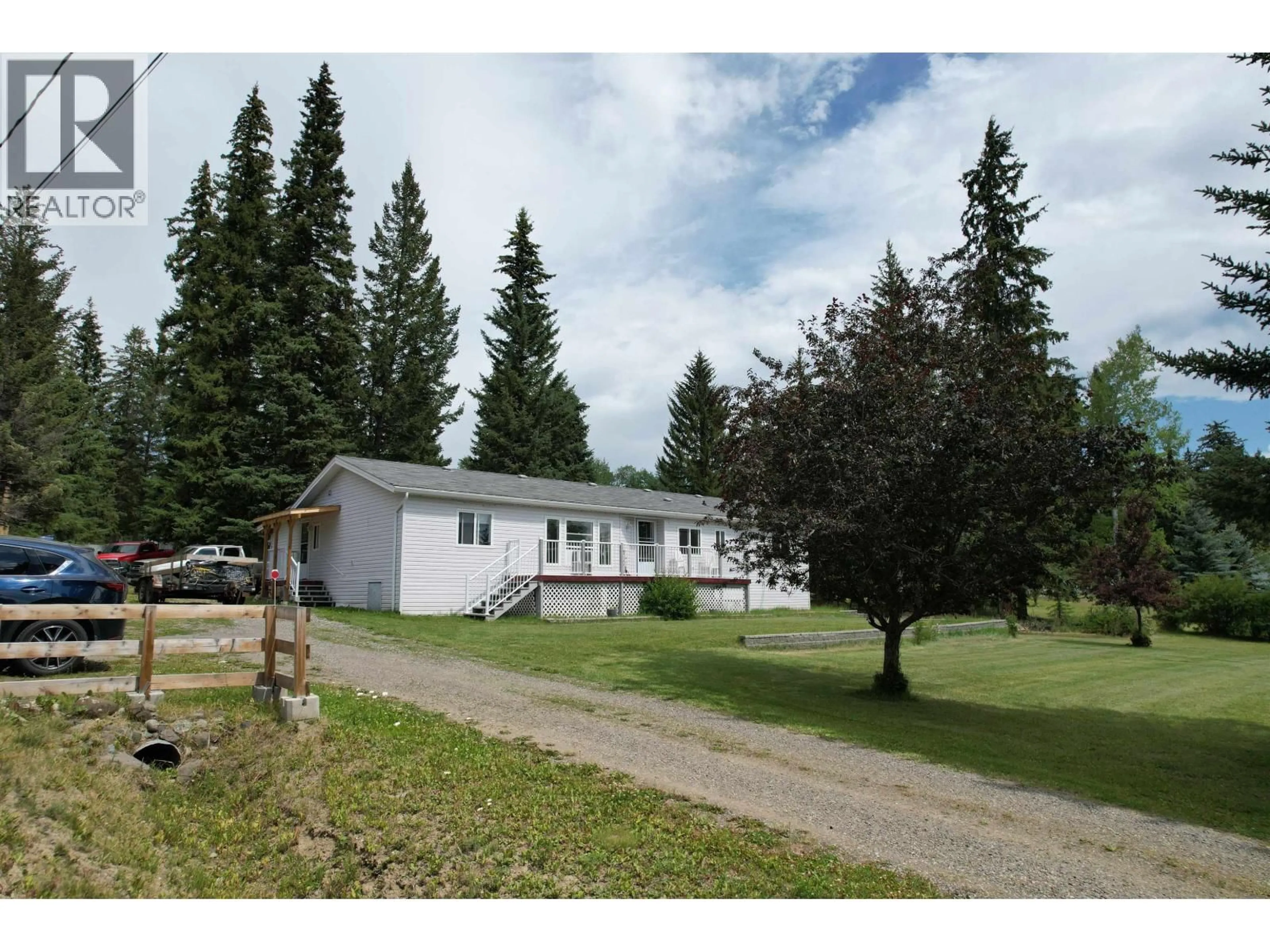 A pic from outside/outdoor area/front of a property/back of a property/a pic from drone, unknown for 6089 LAKESHORE DRIVE, 100 Mile House British Columbia V0K2E3
