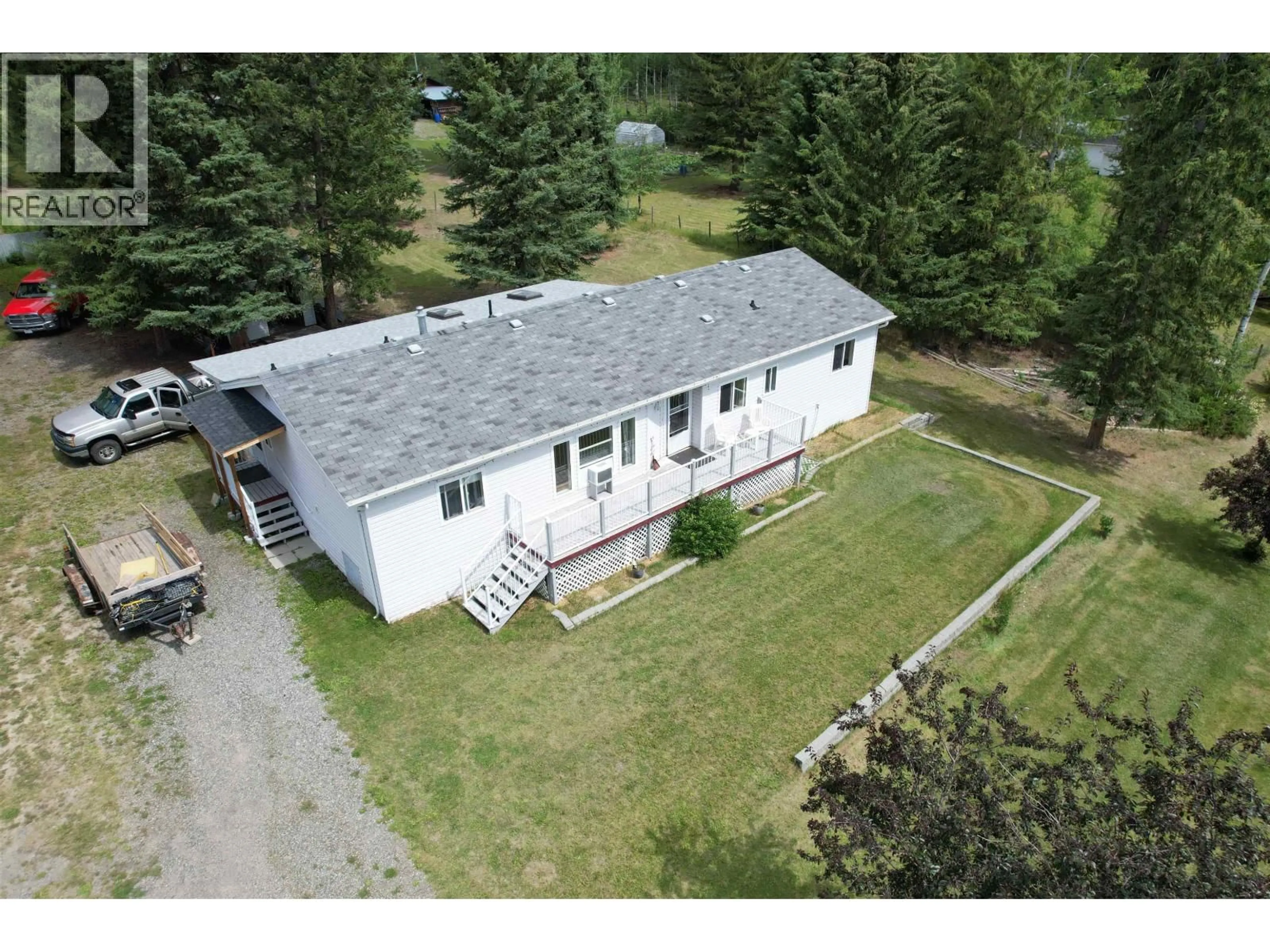 A pic from outside/outdoor area/front of a property/back of a property/a pic from drone, building for 6089 LAKESHORE DRIVE, 100 Mile House British Columbia V0K2E3