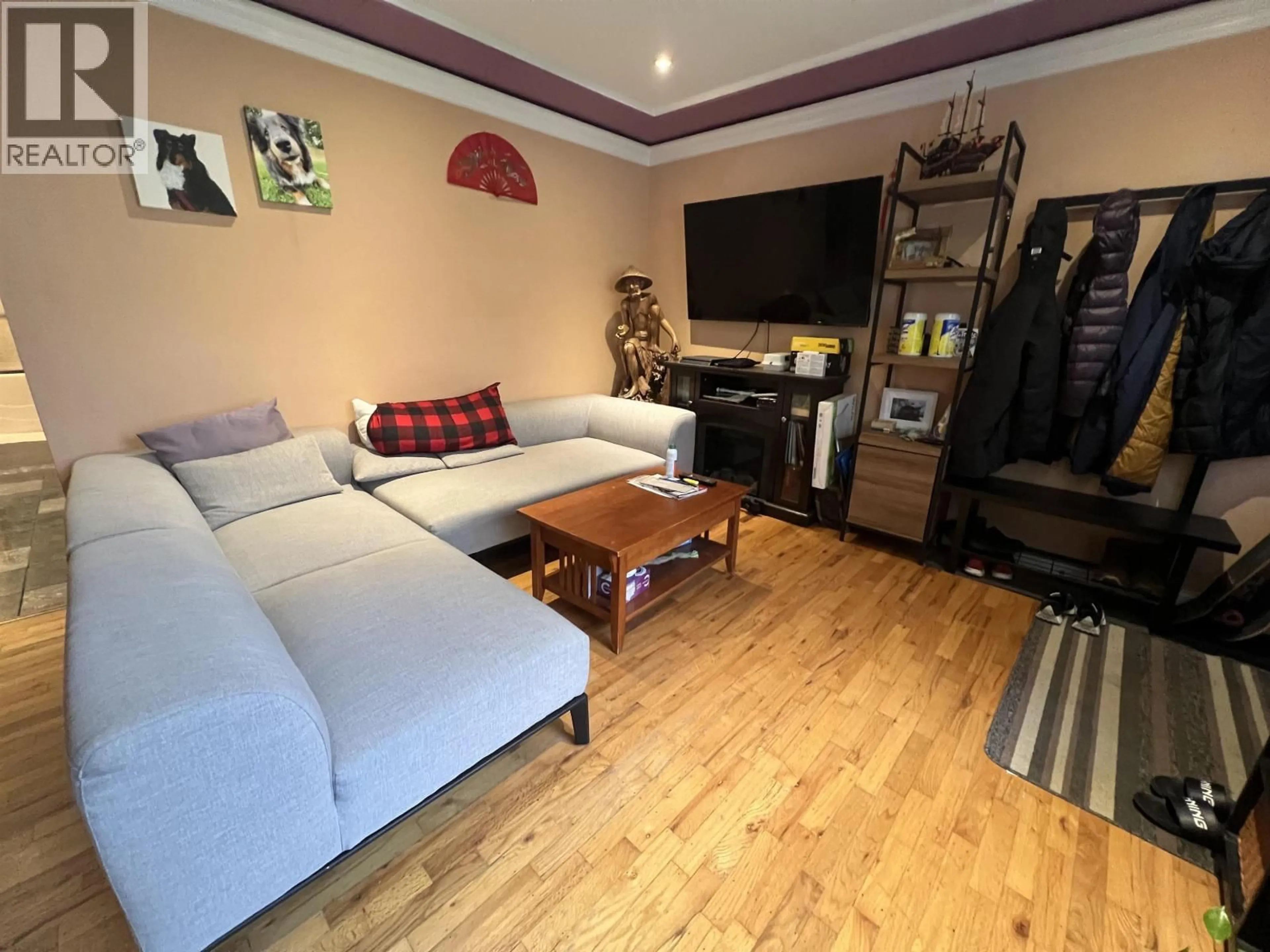 Living room with furniture, wood/laminate floor for 3438 NAPIER STREET, Vancouver British Columbia V5K2X6