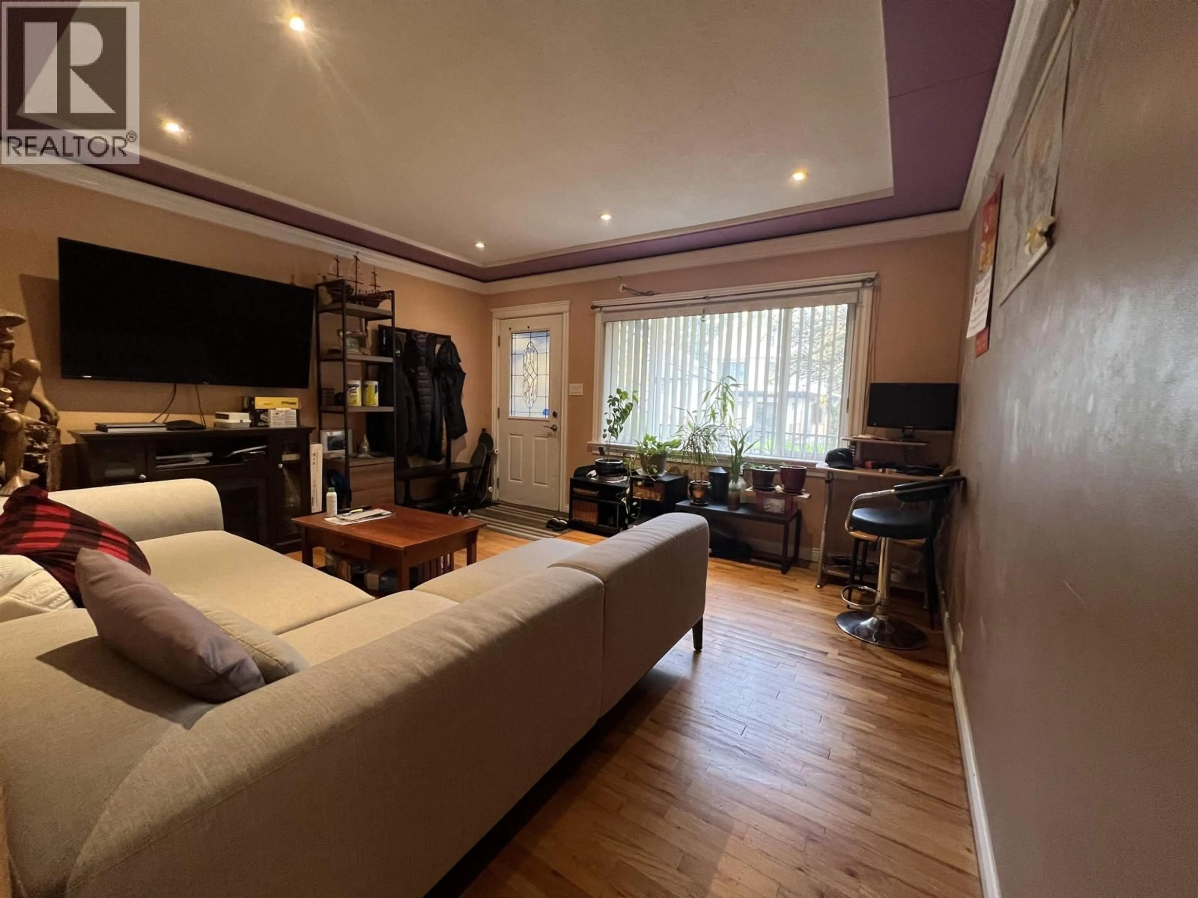 Living room with furniture, wood/laminate floor for 3438 NAPIER STREET, Vancouver British Columbia V5K2X6