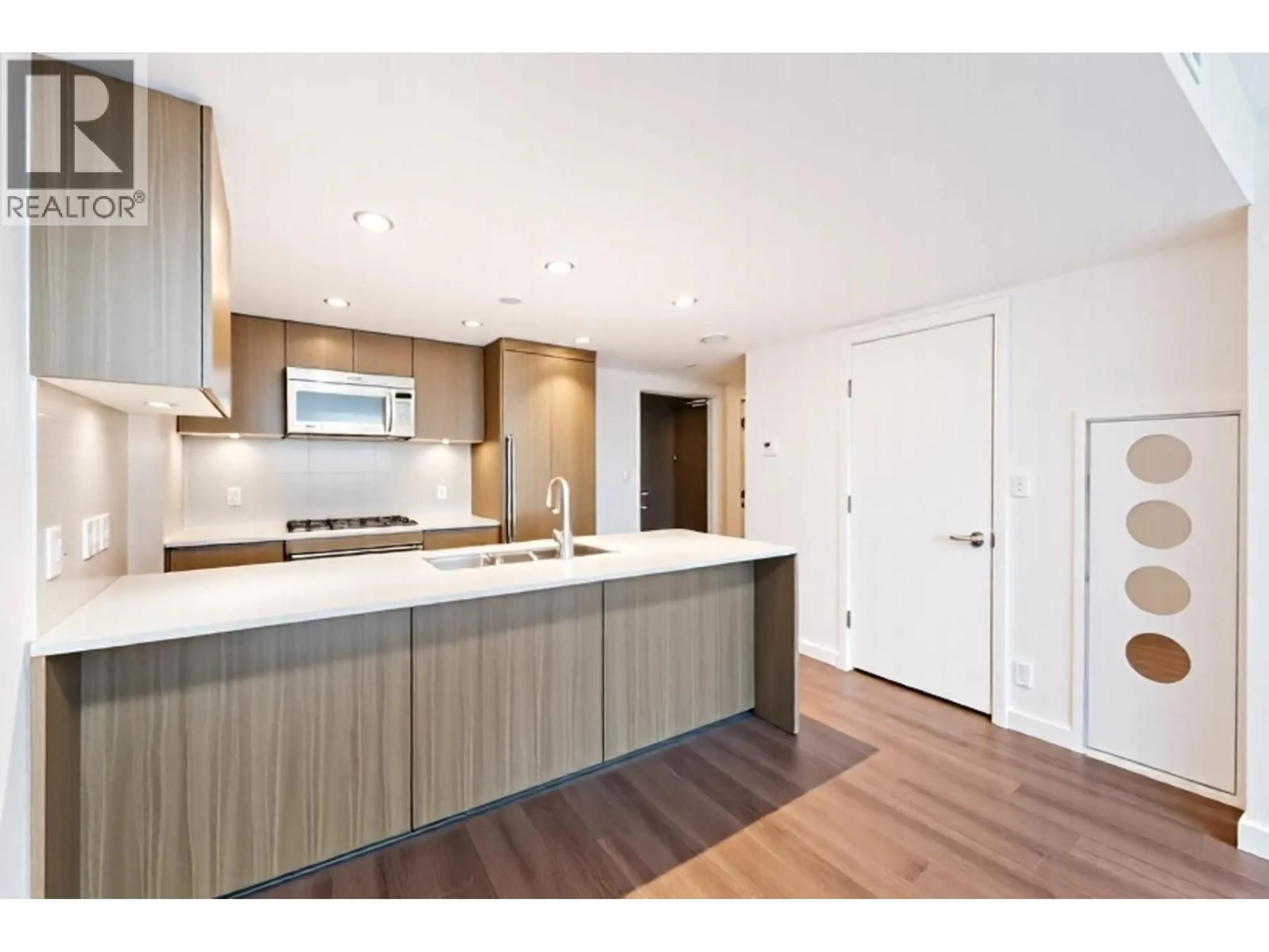 Open concept kitchen, wood/laminate floor for 2105 - 125 14TH STREET, North Vancouver British Columbia V7L0E6