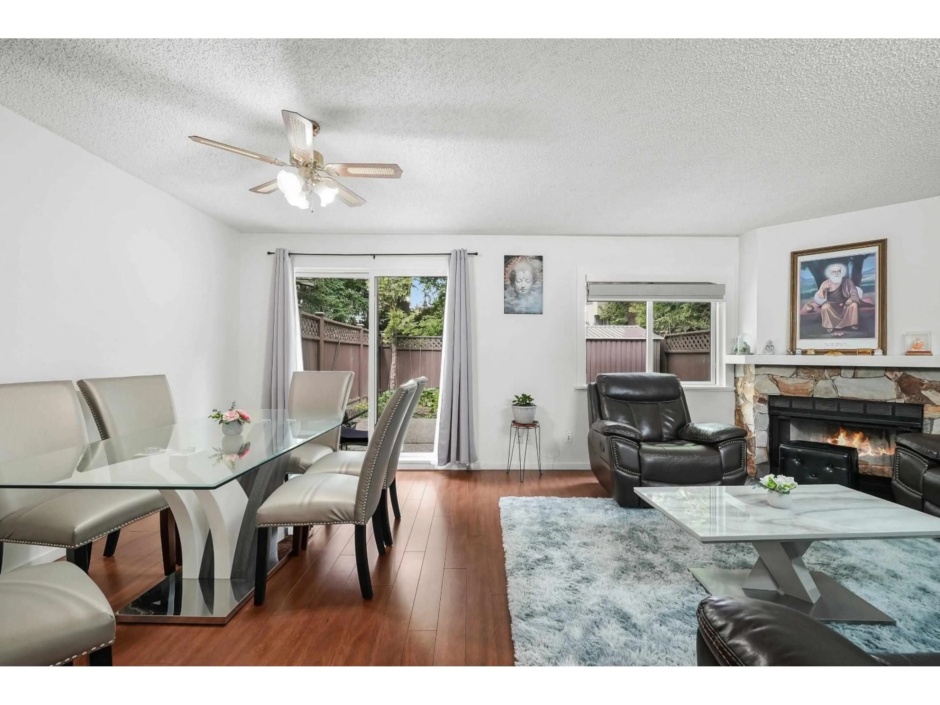 Living room with furniture, wood/laminate floor for 13349 70B, Surrey British Columbia V3W7Z3
