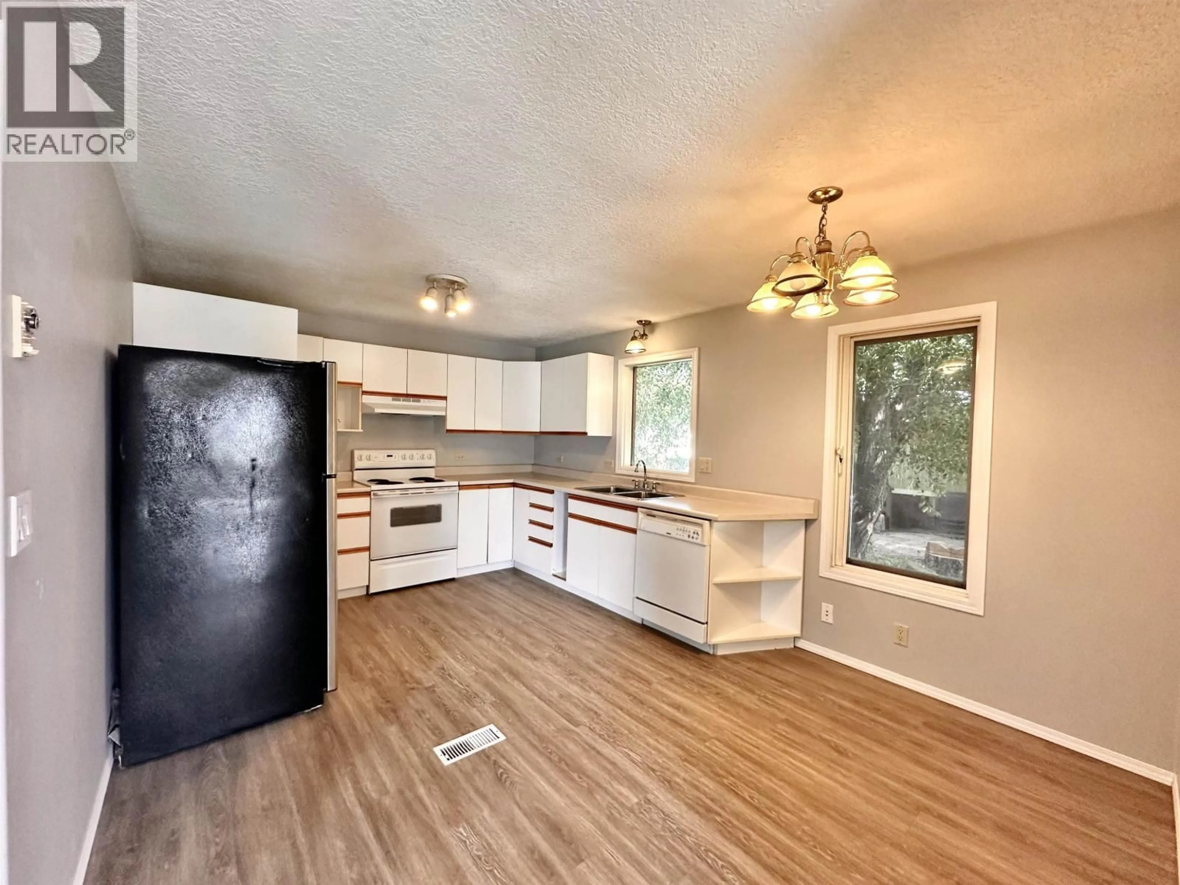 Open concept kitchen, wood/laminate floor for 1144 4TH AVENUE, Valemount British Columbia V0E2Z0