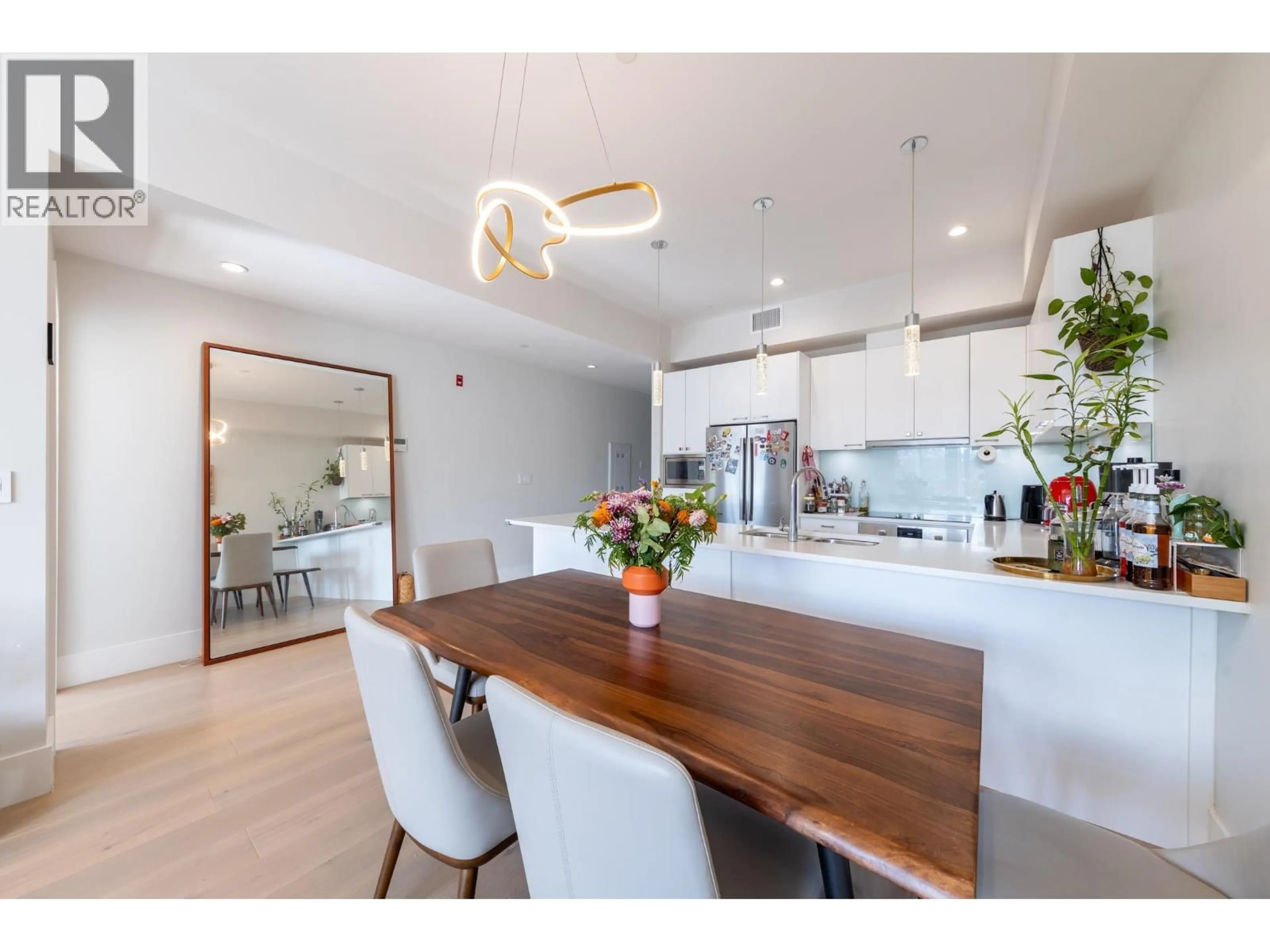 Open concept kitchen, wood/laminate floor for 205 - 1591 BOWSER AVENUE, North Vancouver British Columbia V7P2Y4