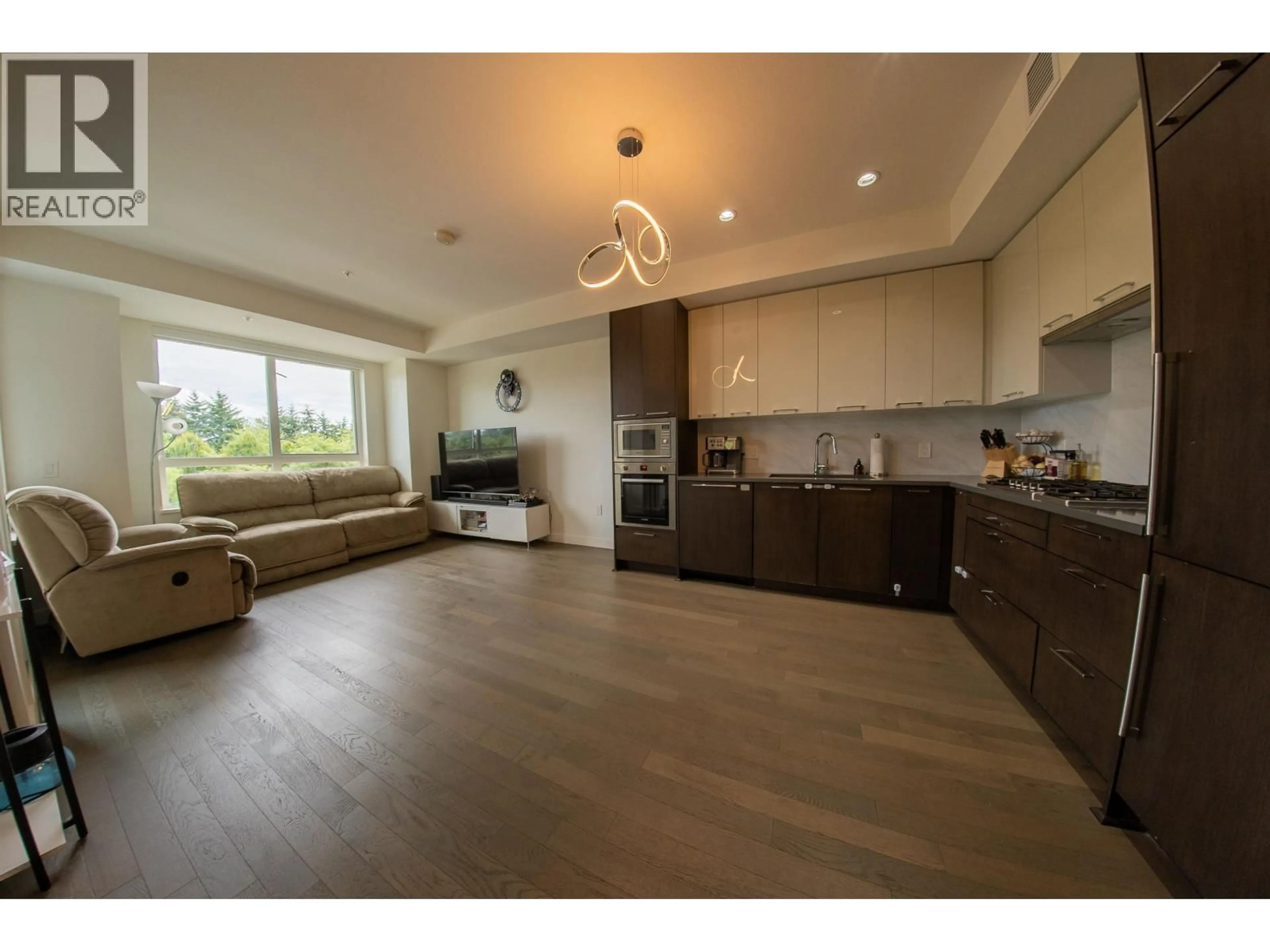 Open concept kitchen, wood/laminate floor for 233 - 4033 MAY DRIVE, Richmond British Columbia V6X0T3