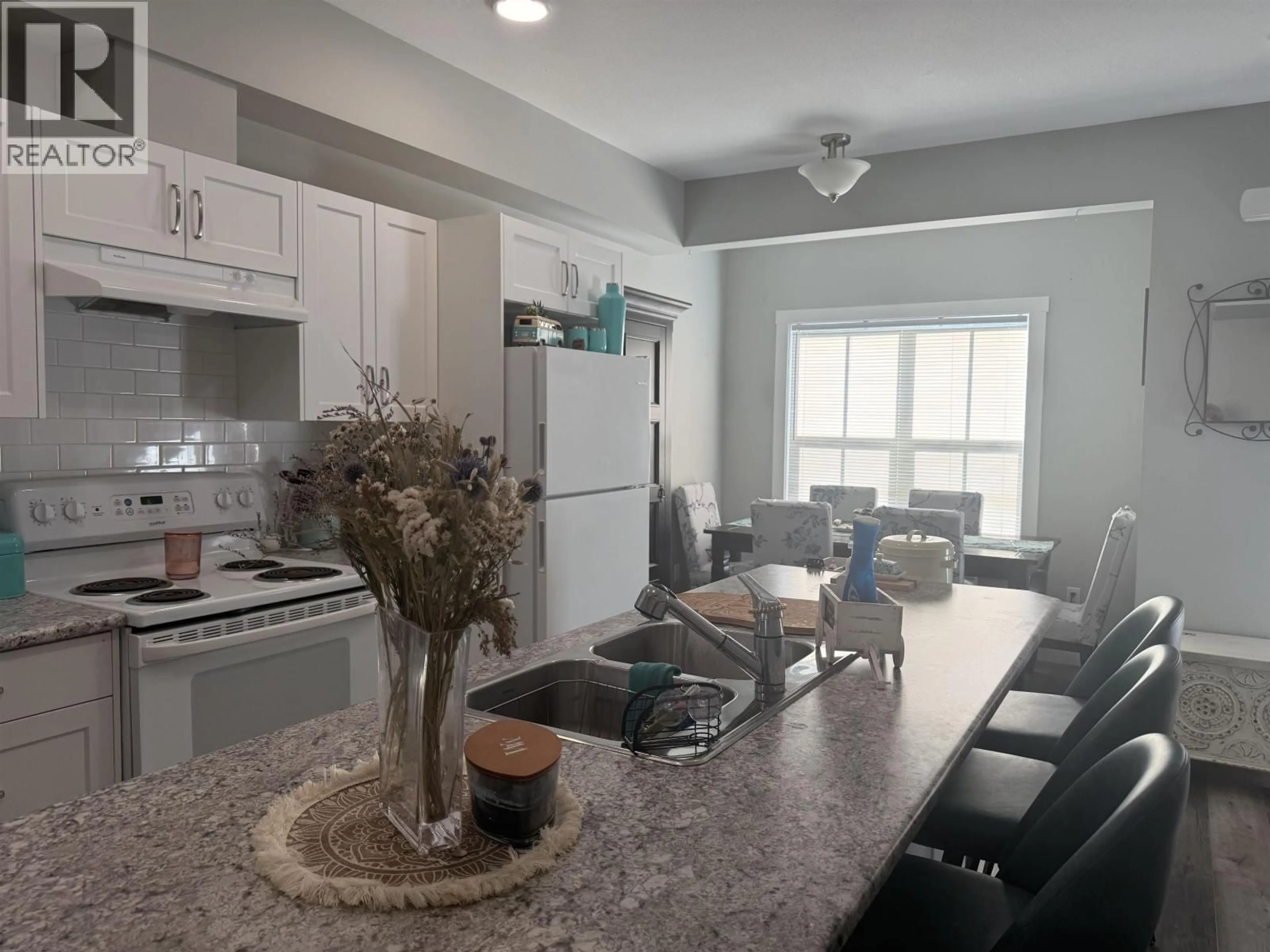 Open concept kitchen, ceramic/tile floor for 1505 - 11703 102 STREET, Fort St. John British Columbia V1J0R7