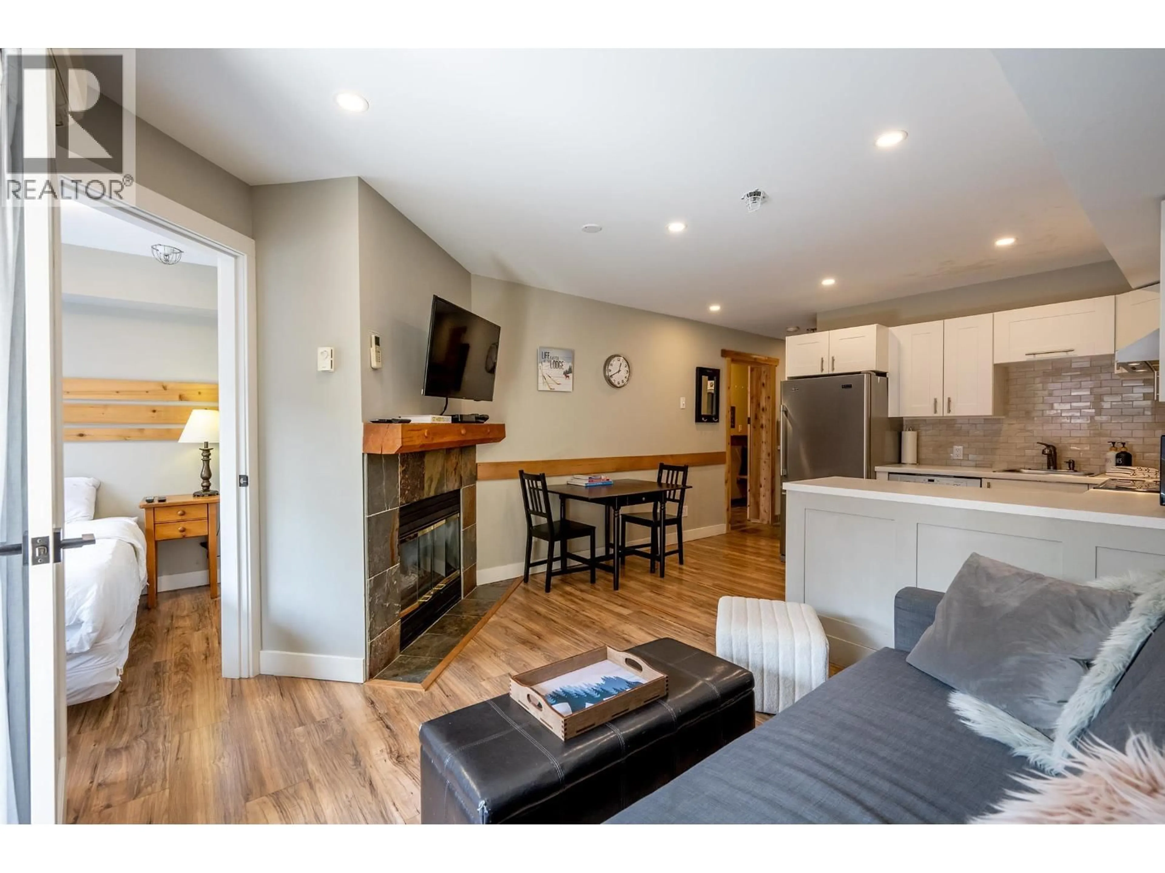 Open concept kitchen, wood/laminate floor for 347 - 4340 LORIMER ROAD, Whistler British Columbia V8E1A5