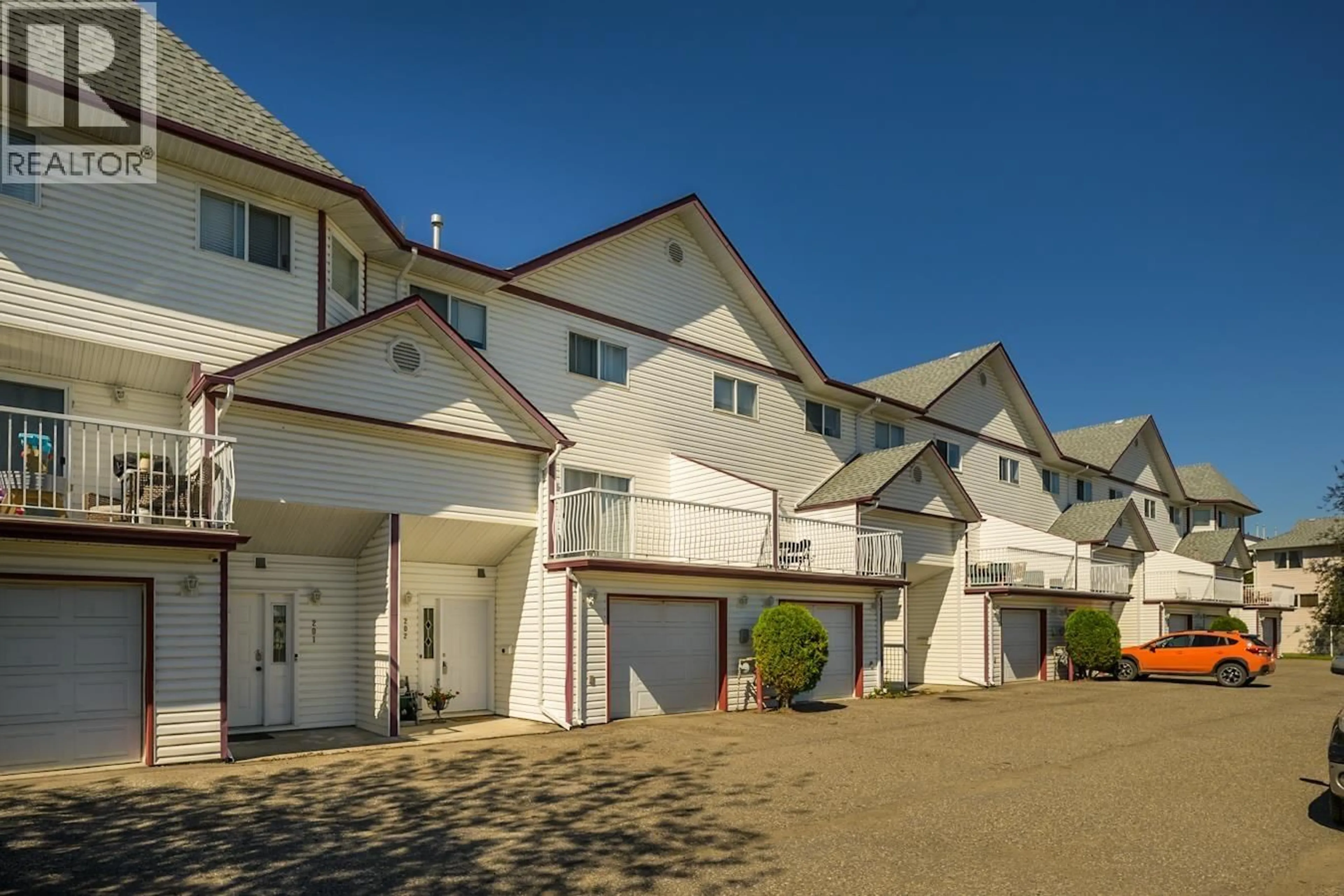 A pic from outside/outdoor area/front of a property/back of a property/a pic from drone, street for 202 - 3363 WESTWOOD DRIVE, Prince George British Columbia V2N1S4