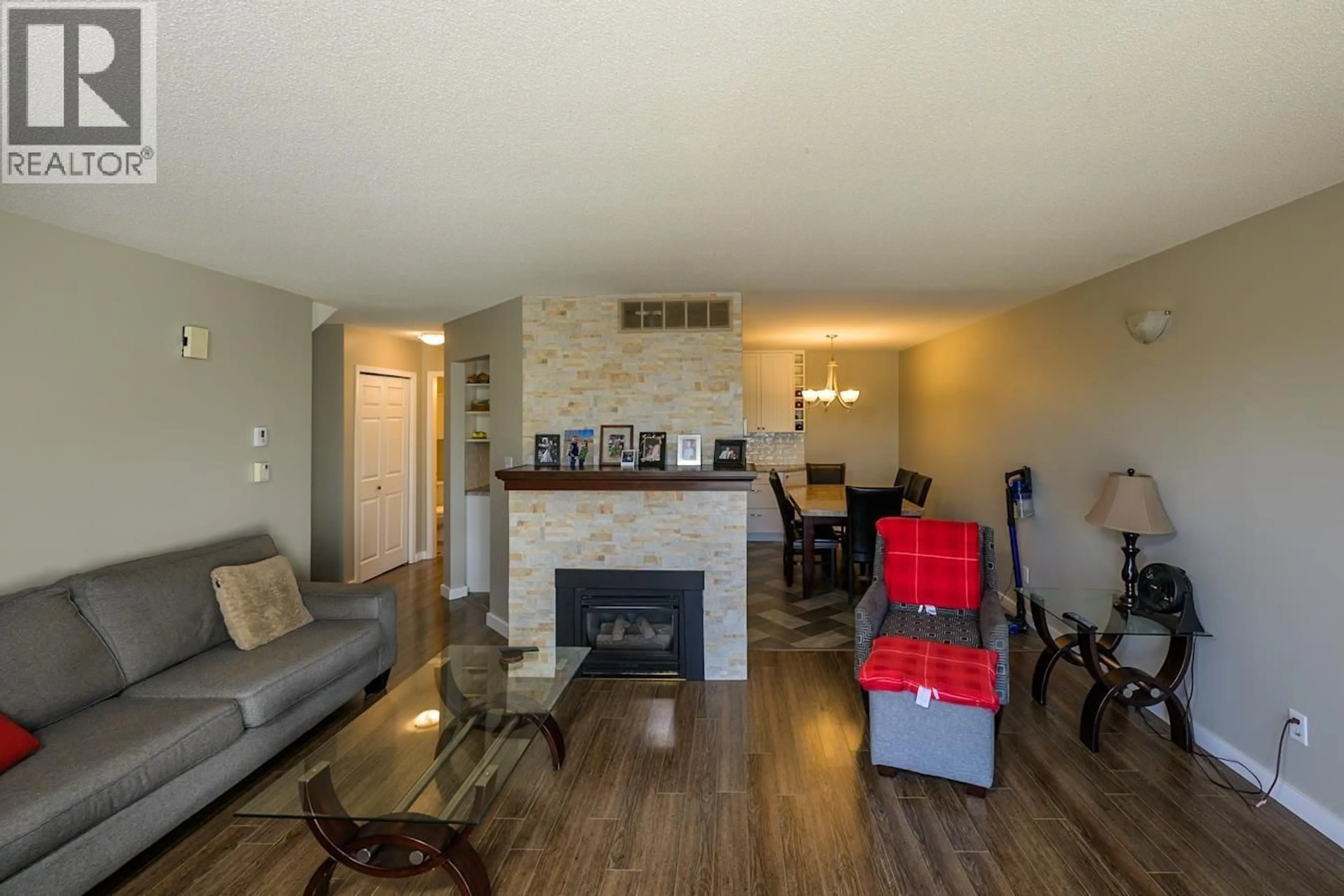 Living room with furniture, wood/laminate floor for 202 - 3363 WESTWOOD DRIVE, Prince George British Columbia V2N1S4