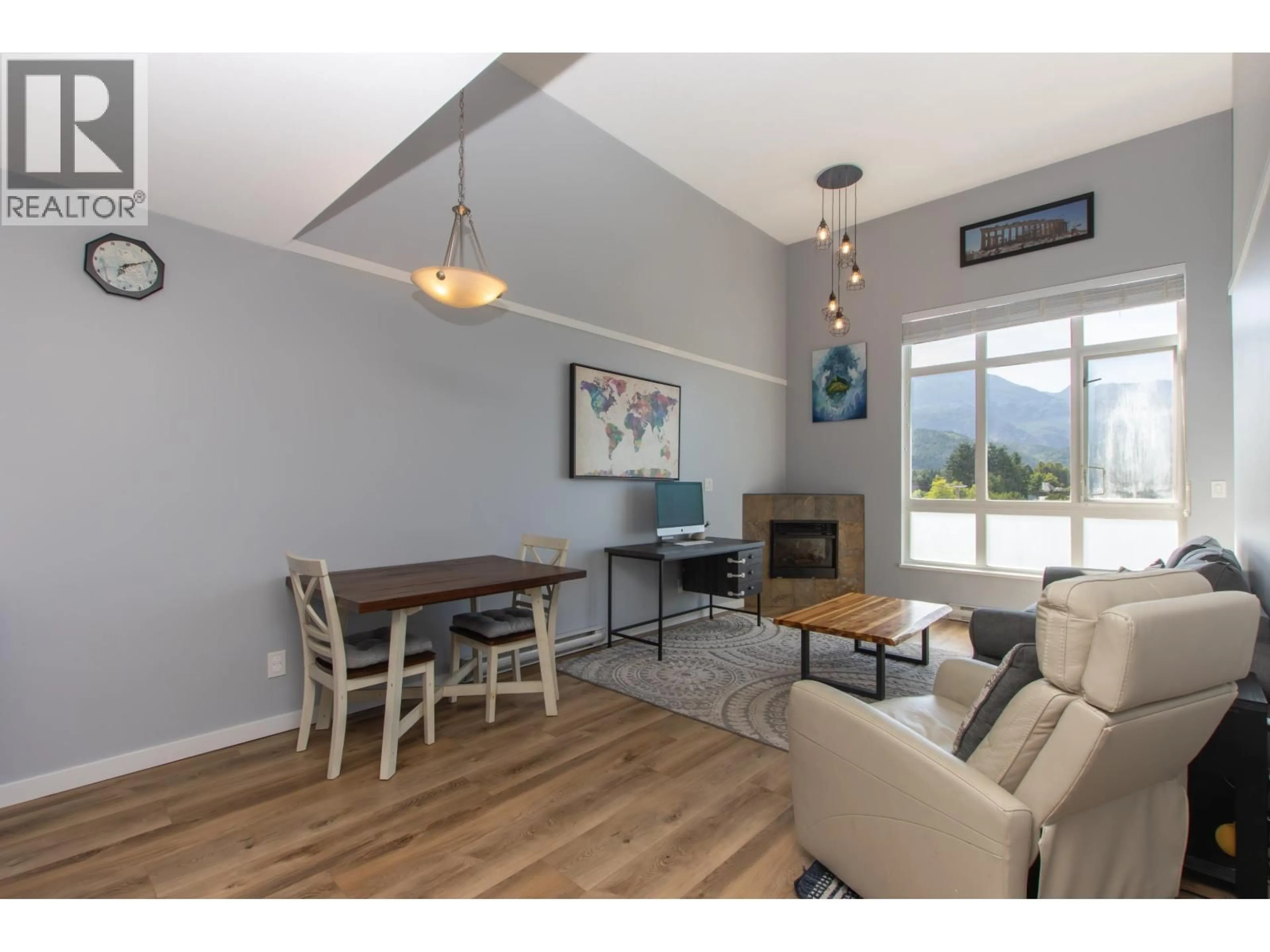 Living room with furniture, wood/laminate floor for 403 - 40437 TANTALUS ROAD, Squamish British Columbia V0N1T0