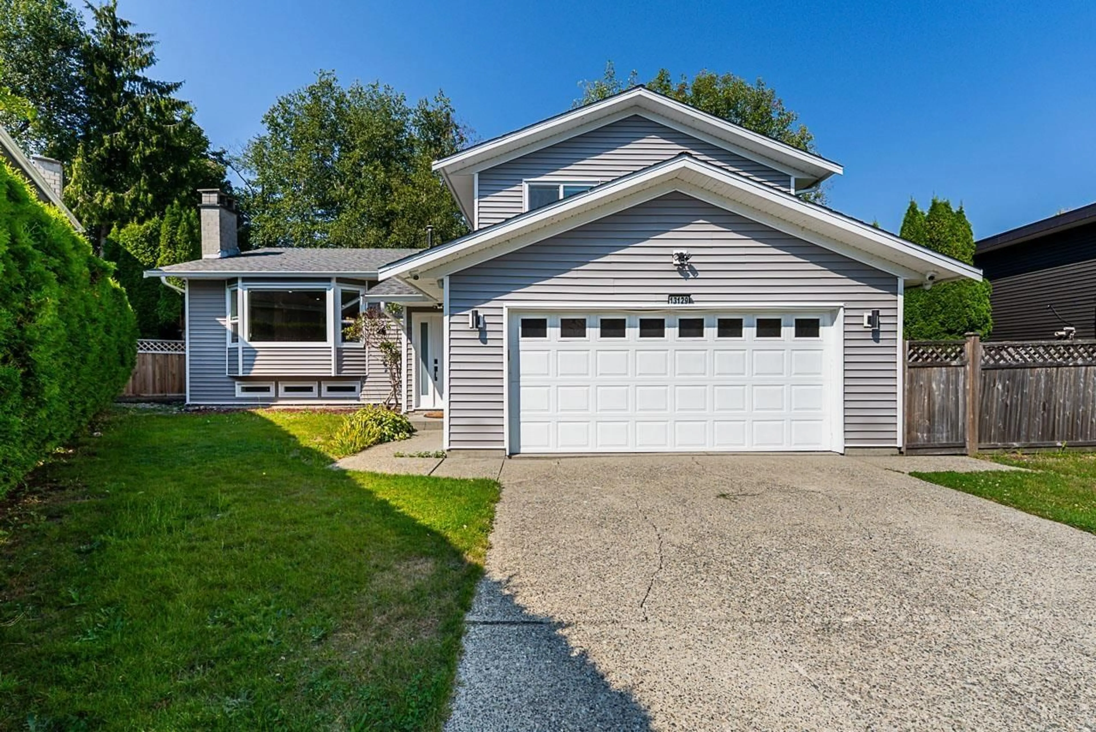 Home with vinyl exterior material, street for 13129 62B, Surrey British Columbia V3X1P4