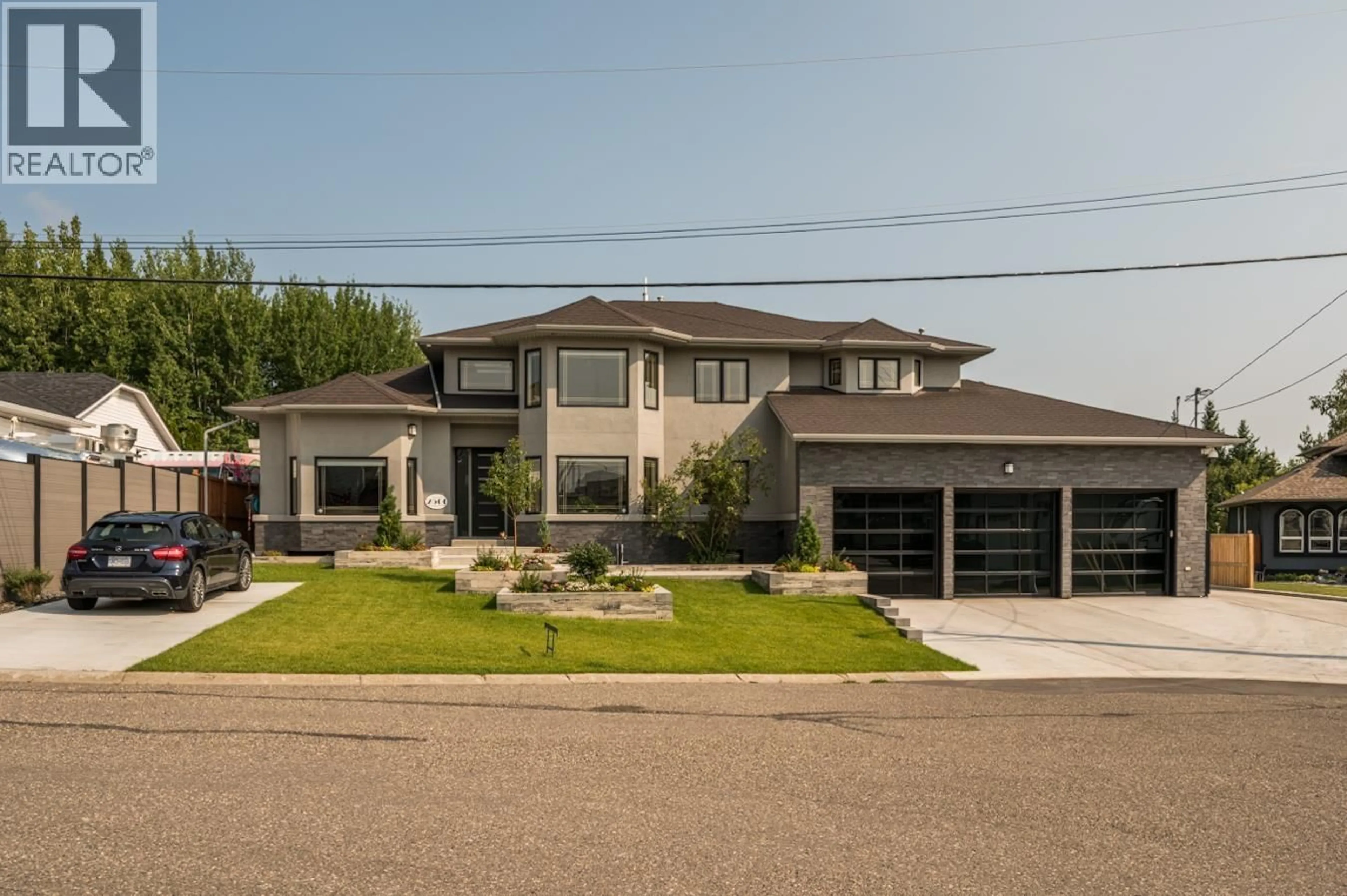 Home with brick exterior material, street for 2500 MARLEAU DRIVE, Prince George British Columbia V2N5G5