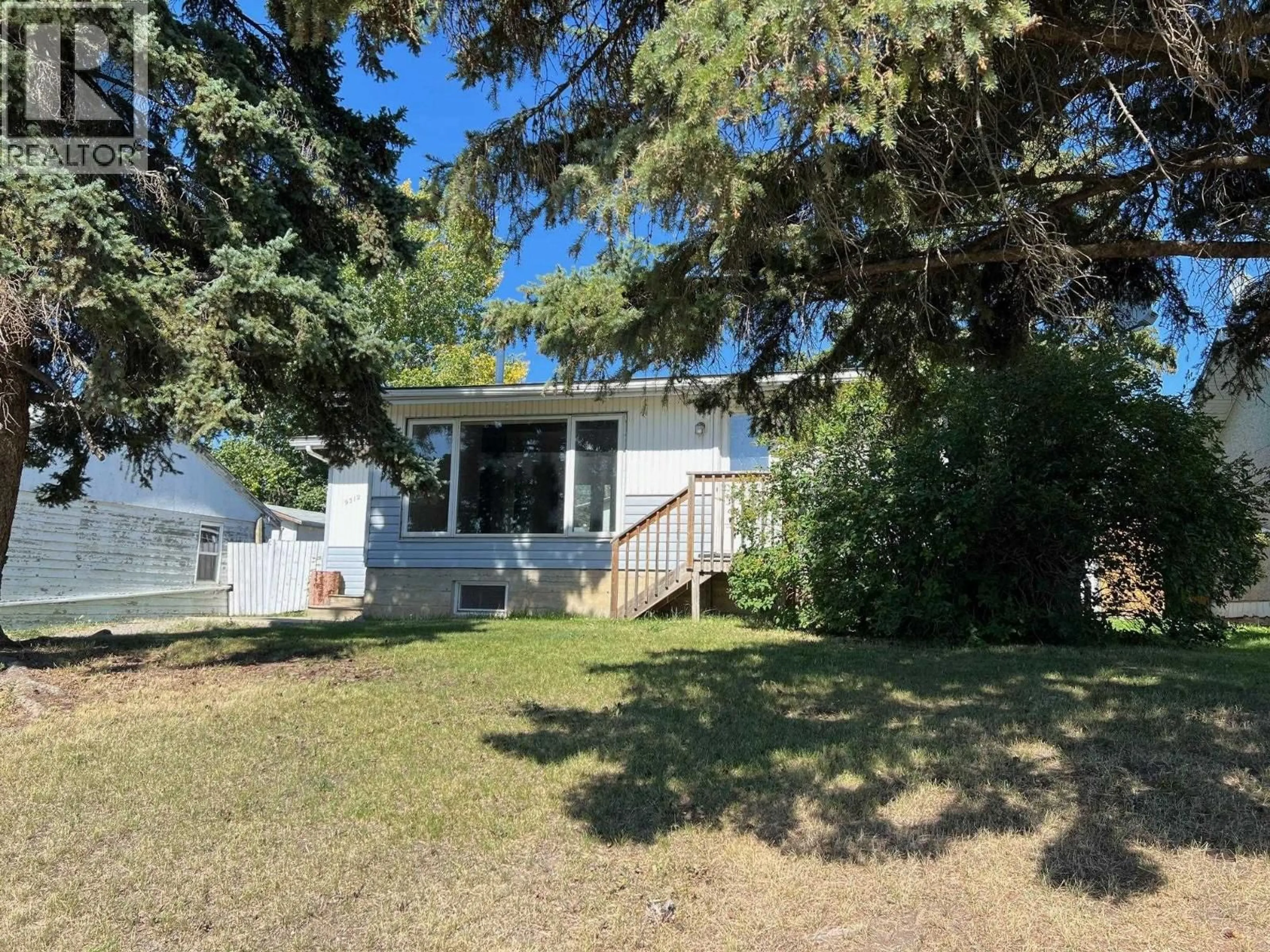 A pic from outside/outdoor area/front of a property/back of a property/a pic from drone, street for 9312 97 AVENUE, Fort St. John British Columbia V1J1M6