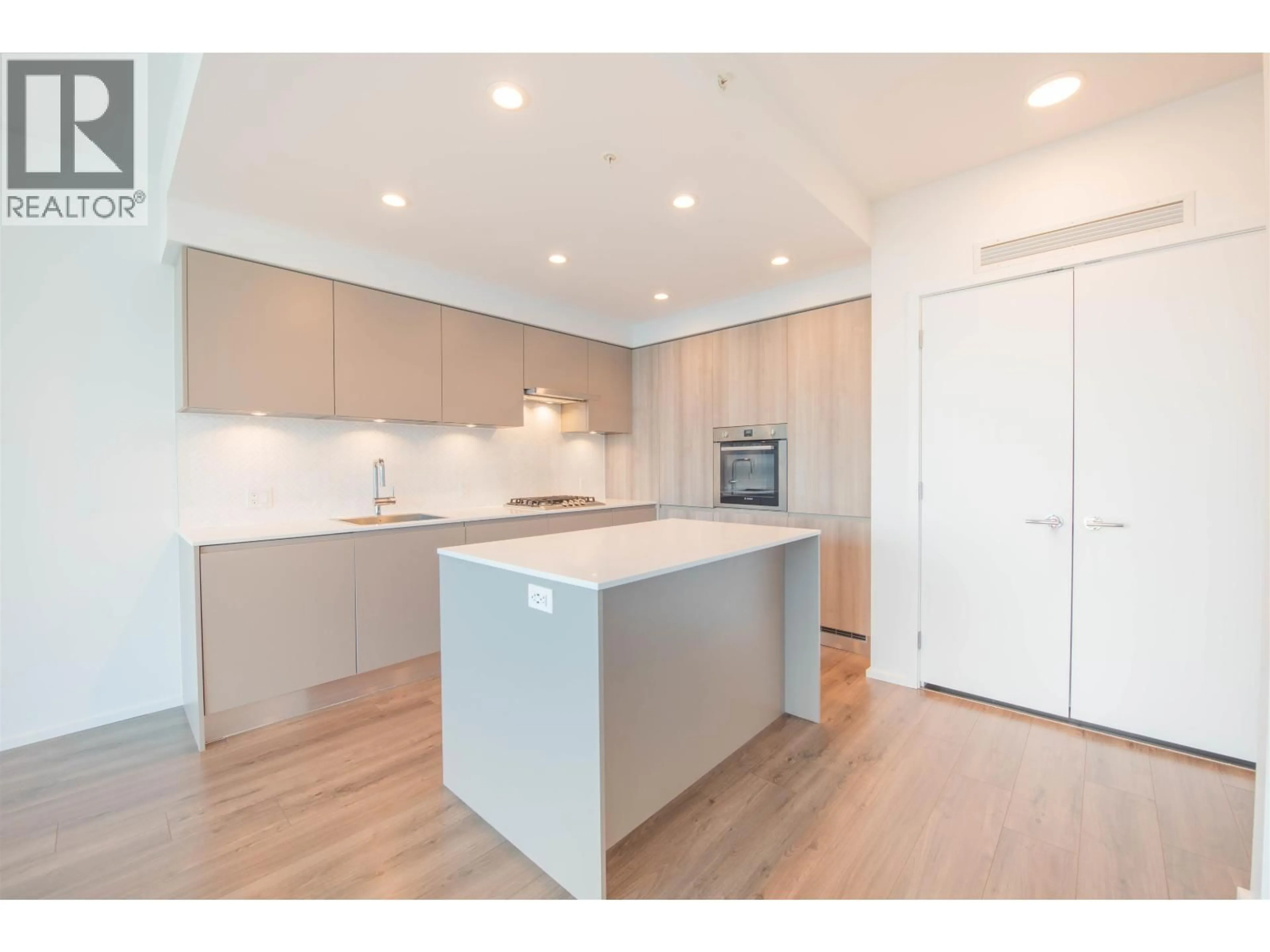 Open concept kitchen, wood/laminate floor for 3704 - 3809 EVERGREEN PLACE, Burnaby British Columbia V3J0M1
