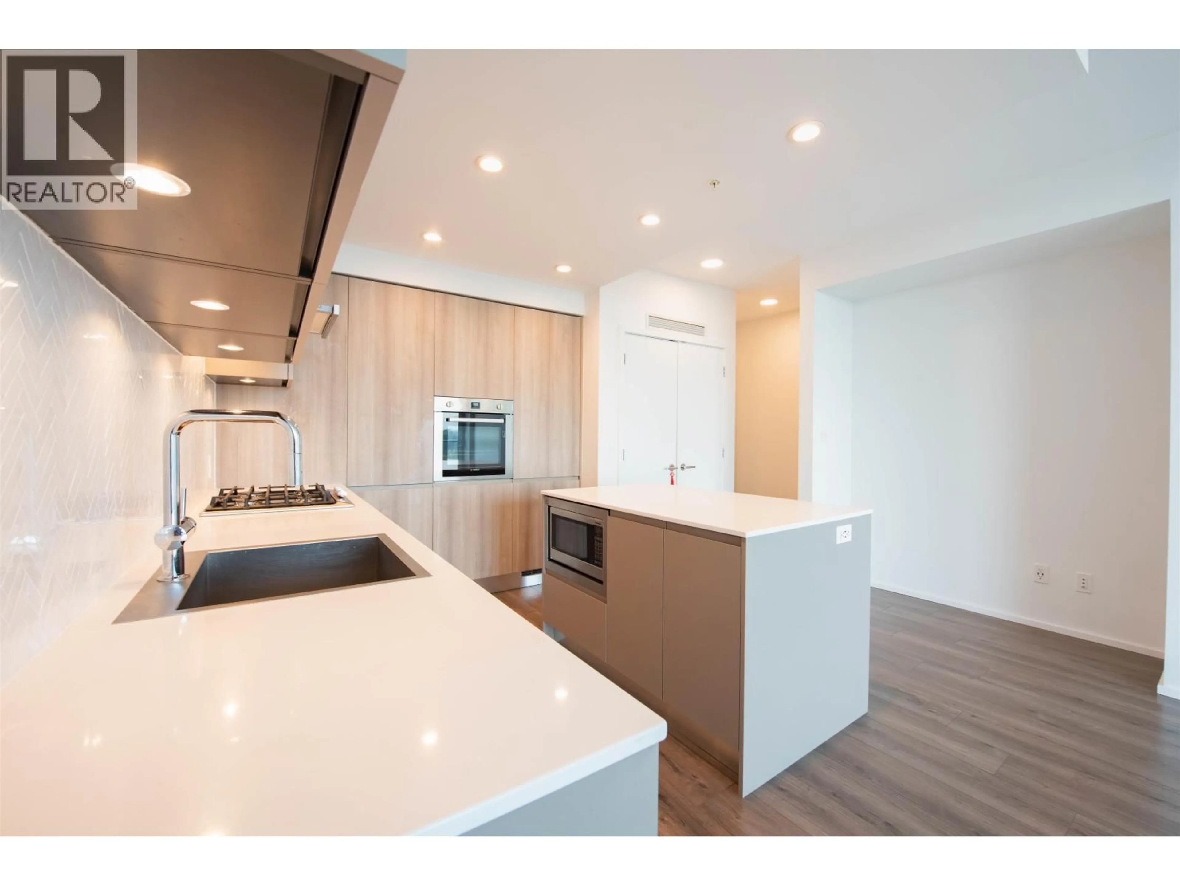 Open concept kitchen, wood/laminate floor for 3704 - 3809 EVERGREEN PLACE, Burnaby British Columbia V3J0M1