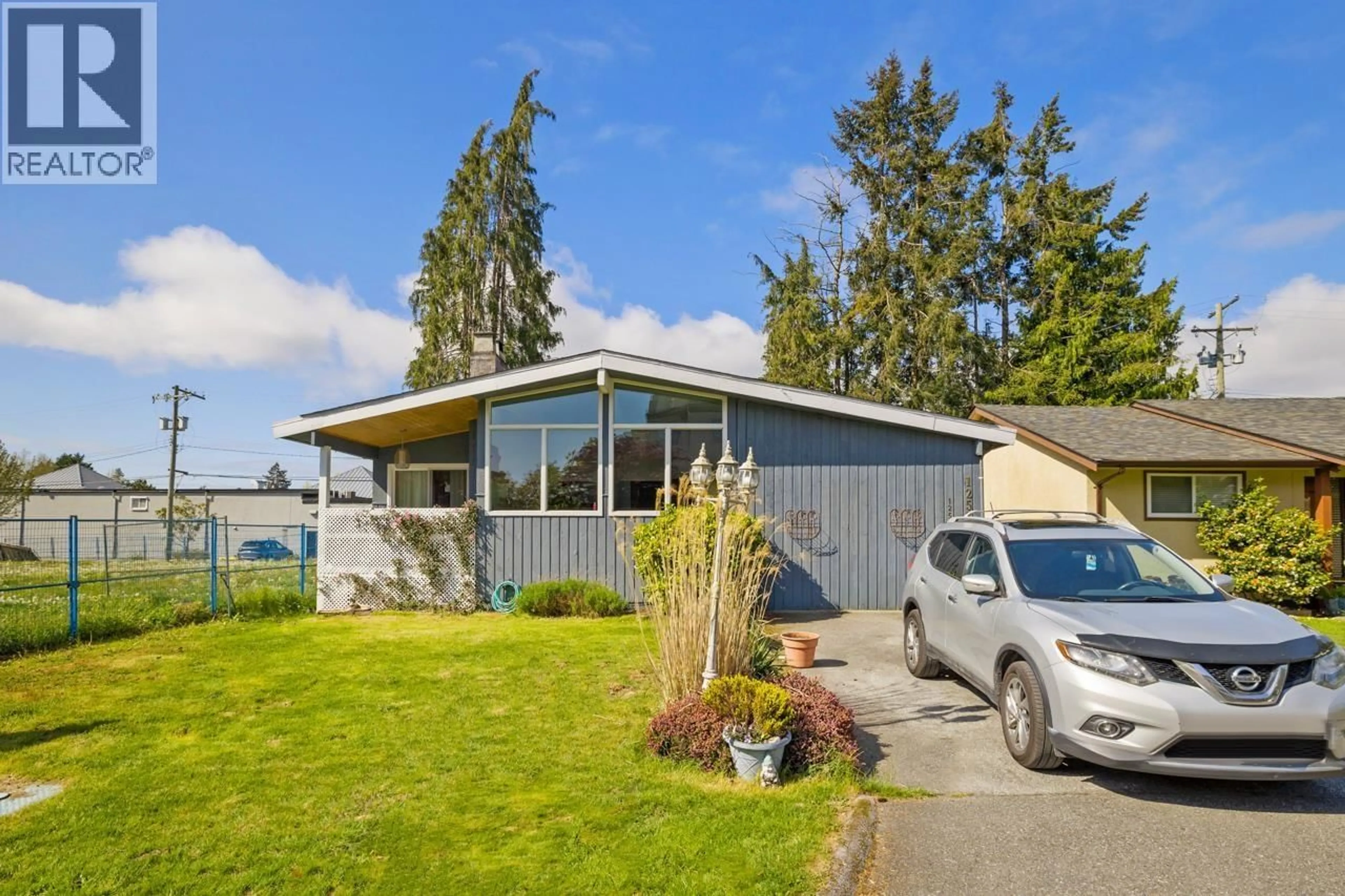 Home with vinyl exterior material, street for 1253 HUNTER ROAD, Delta British Columbia V4L1Y9