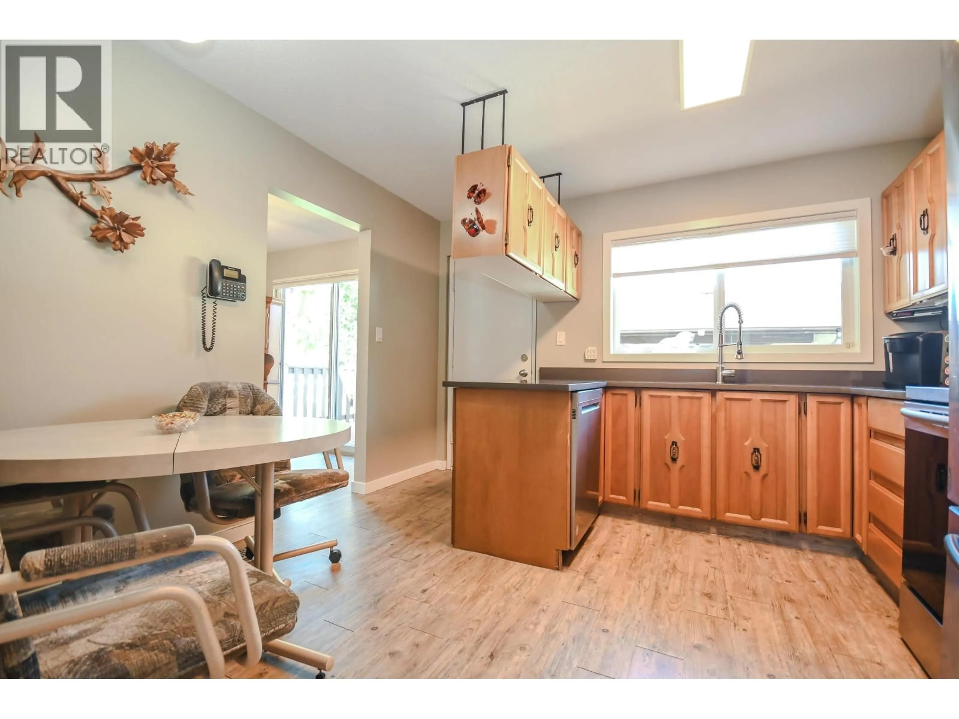 Open concept kitchen, wood/laminate floor for 7536 ST KEVIN PLACE, Prince George British Columbia V2N4L3