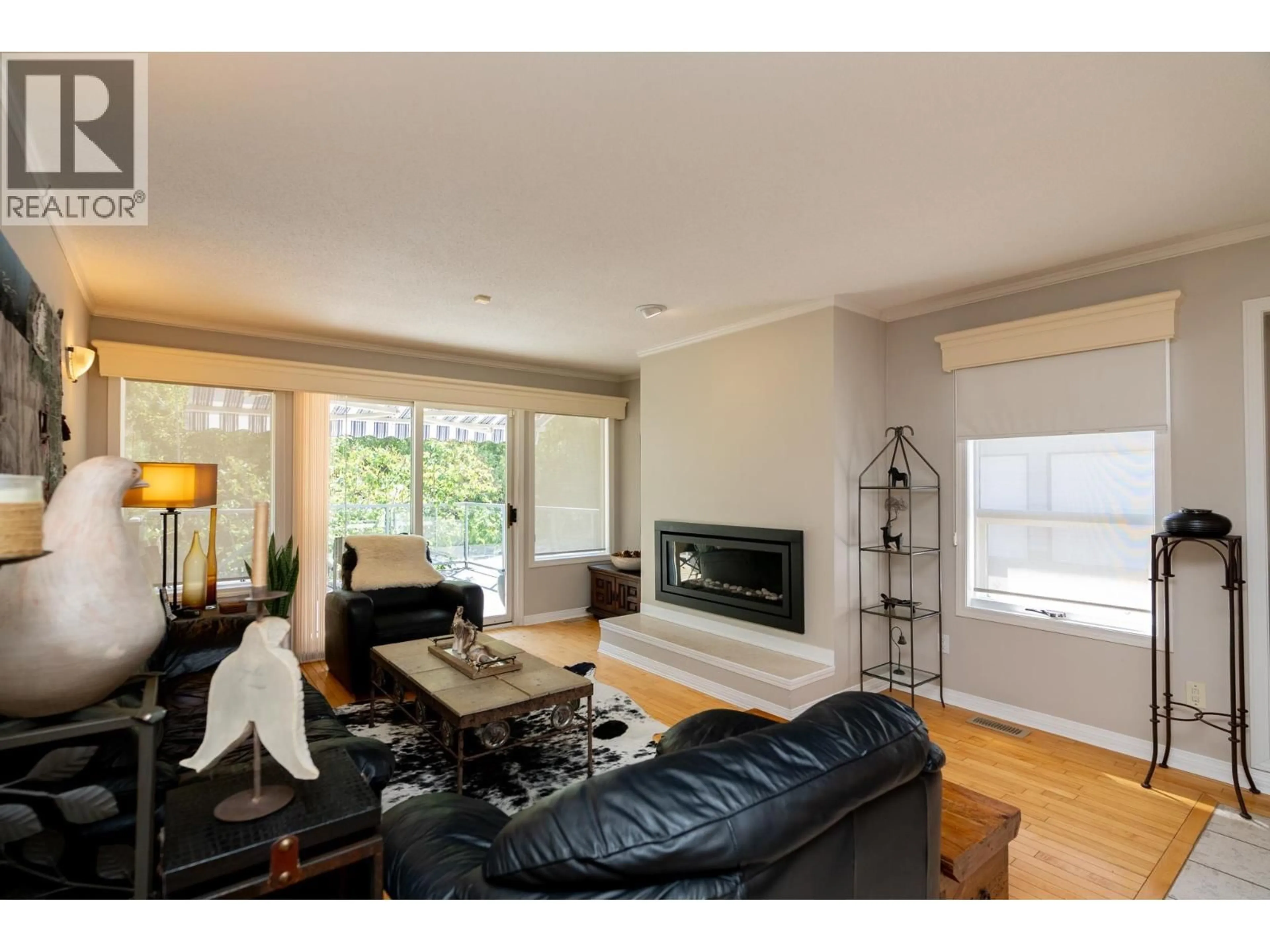 Living room with furniture, wood/laminate floor for 131 - 3500 POZER ROAD, Prince George British Columbia V2K4X6