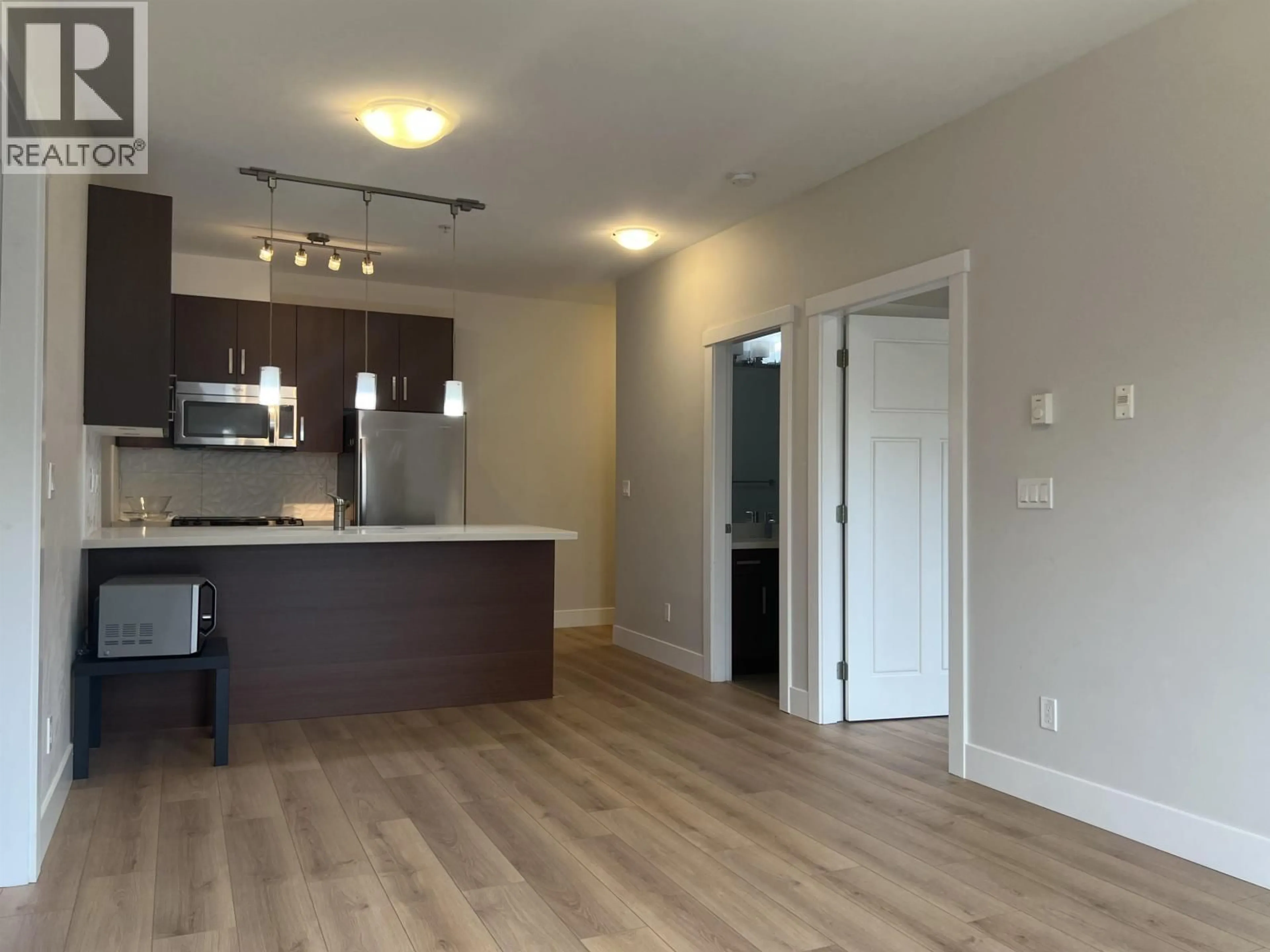 Open concept kitchen, wood/laminate floor for 205 - 5288 BERESFORD STREET, Burnaby British Columbia V5J1H9