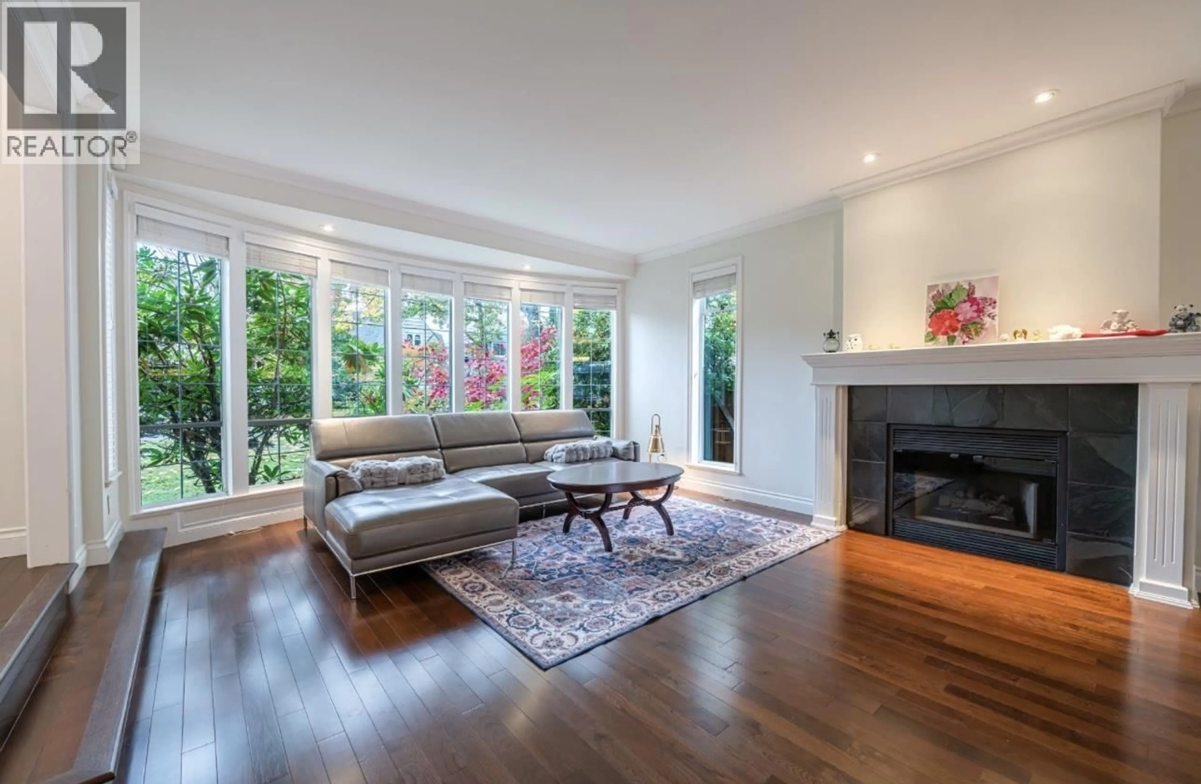 Living room with furniture, wood/laminate floor for 4570 13TH AVENUE, Vancouver British Columbia V6R2V4