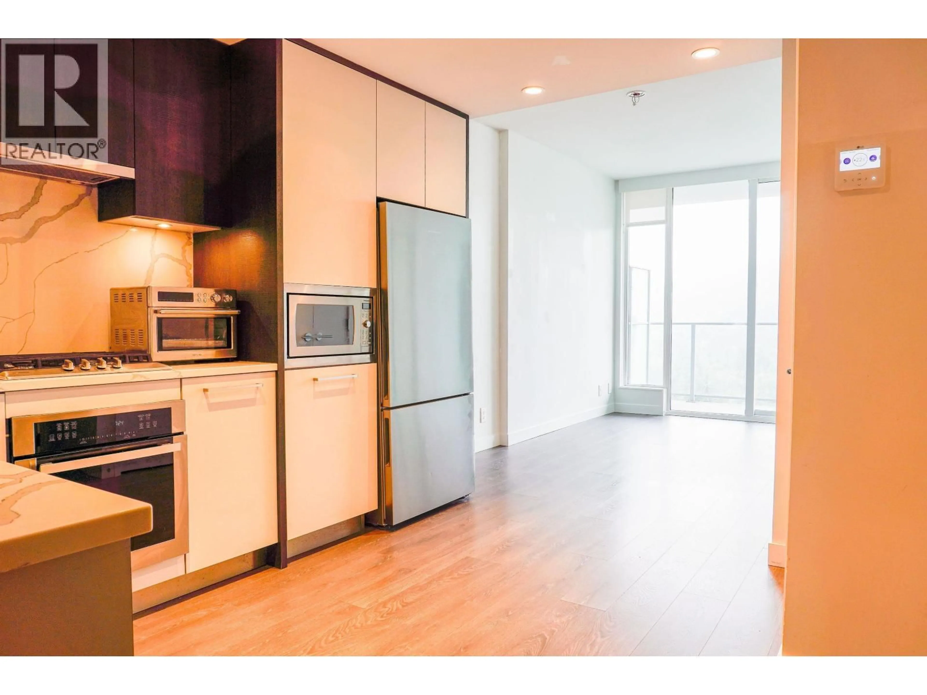 Open concept kitchen, wood/laminate floor for 1103 - 567 CLARKE ROAD, Coquitlam British Columbia V3J0K7