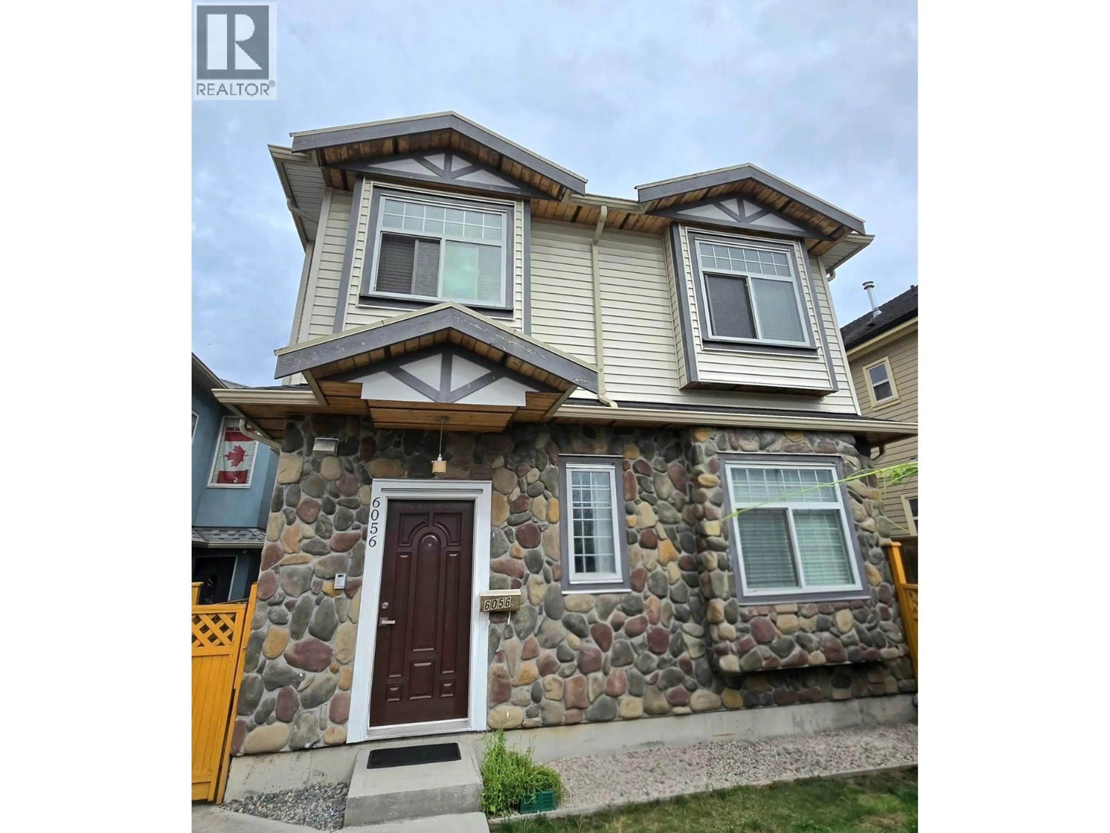 Home with vinyl exterior material, street for 6056 VICTORIA DRIVE, Vancouver British Columbia V5P3X3