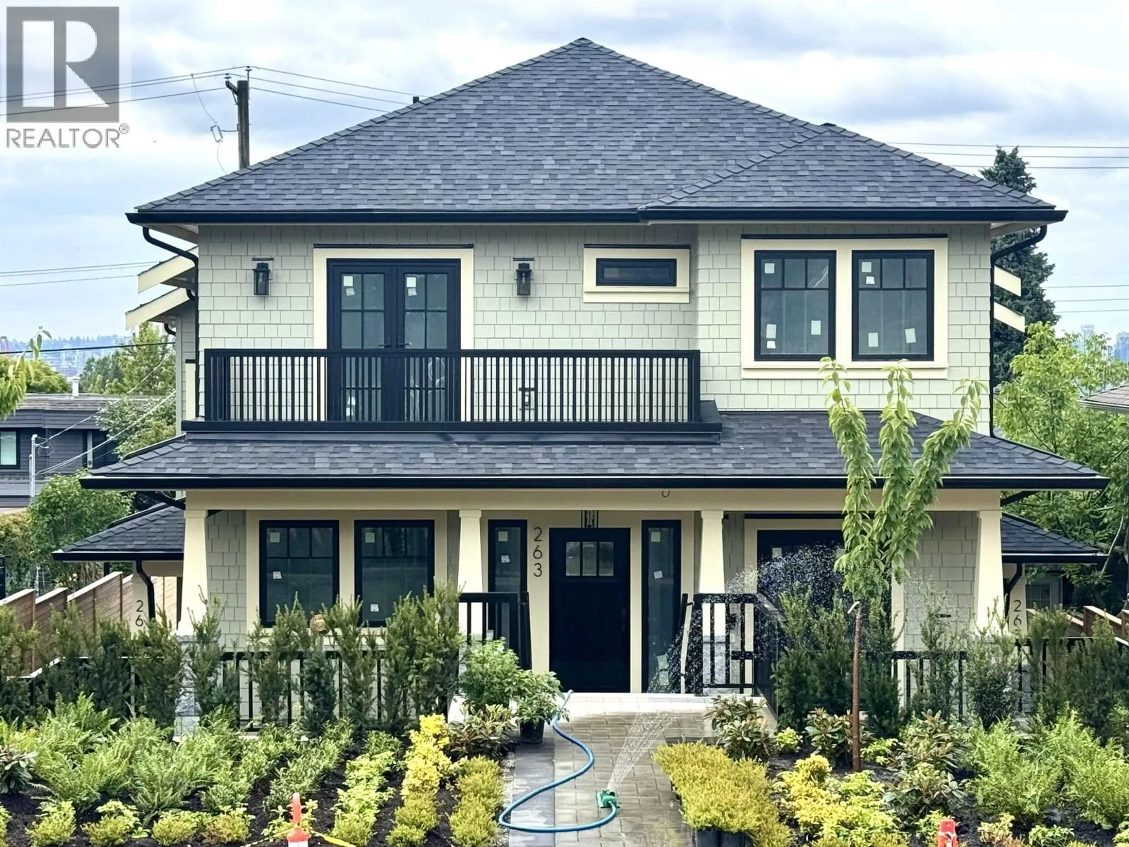 Home with vinyl exterior material, street for 261 6TH STREET, North Vancouver British Columbia V7M1K7