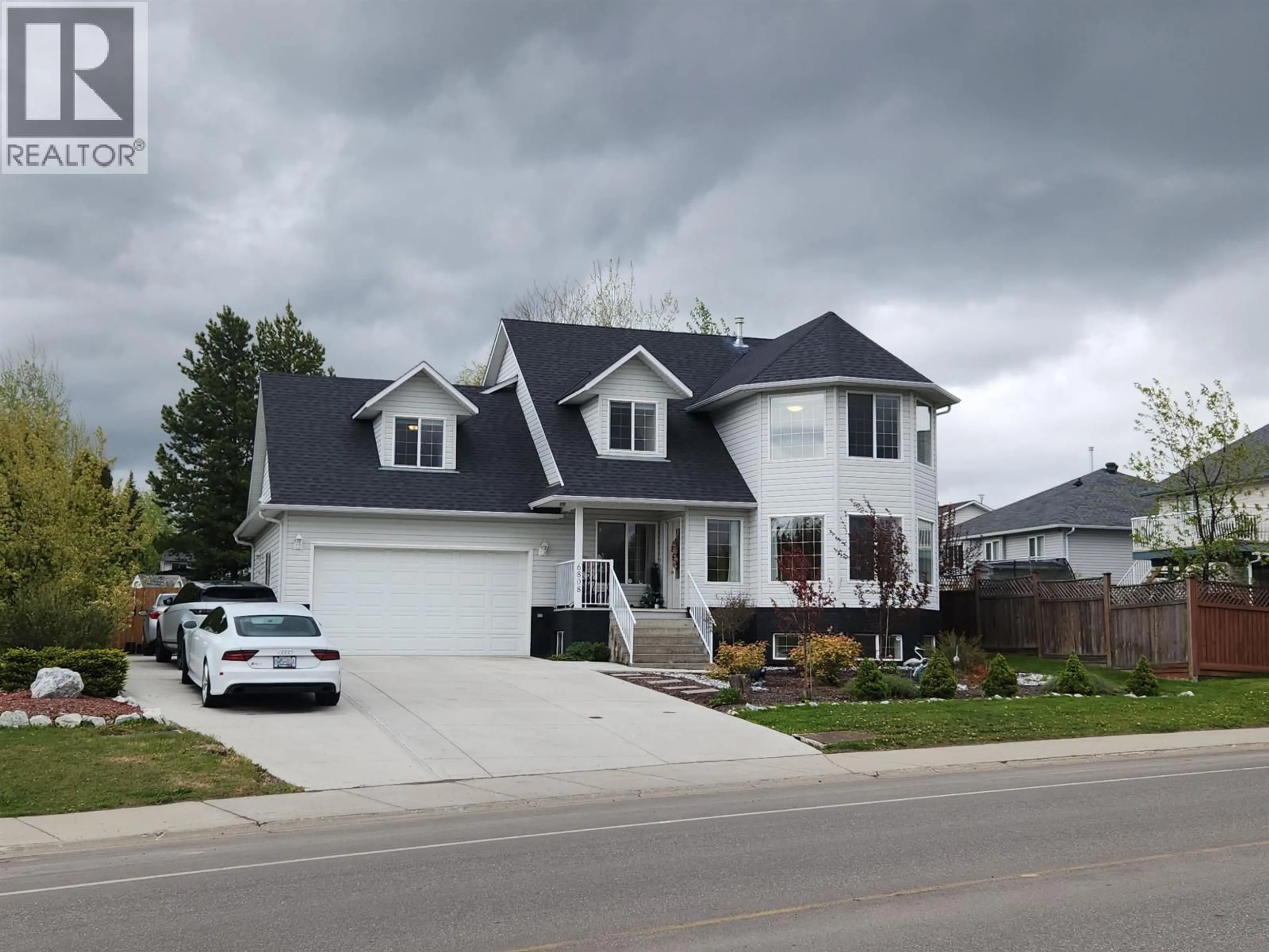 Home with vinyl exterior material, street for 6808 WESTGATE AVENUE, Prince George British Columbia V2N5R2