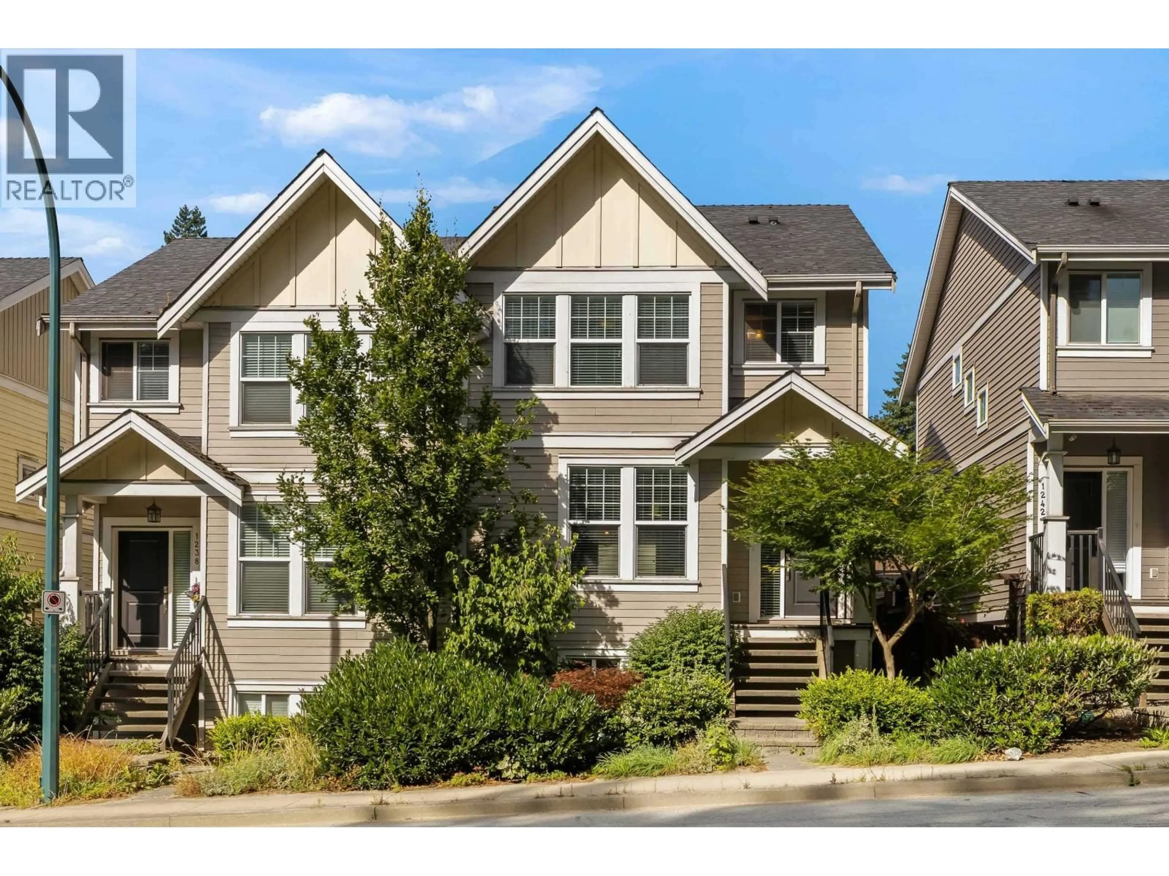 Home with vinyl exterior material, street for 1240 COAST MERIDIAN ROAD, Coquitlam British Columbia V3B0E8