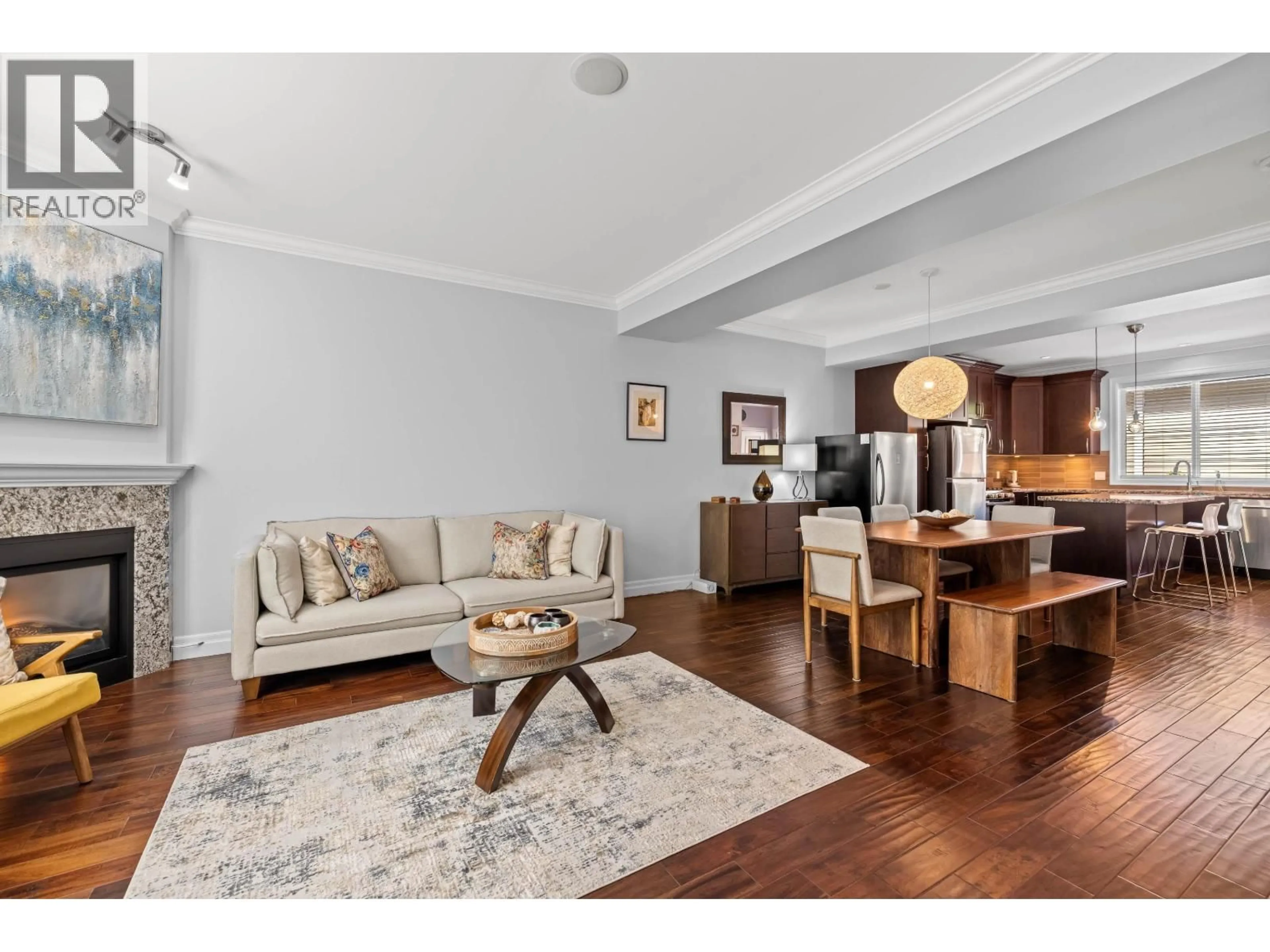 Living room with furniture, wood/laminate floor for 1240 COAST MERIDIAN ROAD, Coquitlam British Columbia V3B0E8