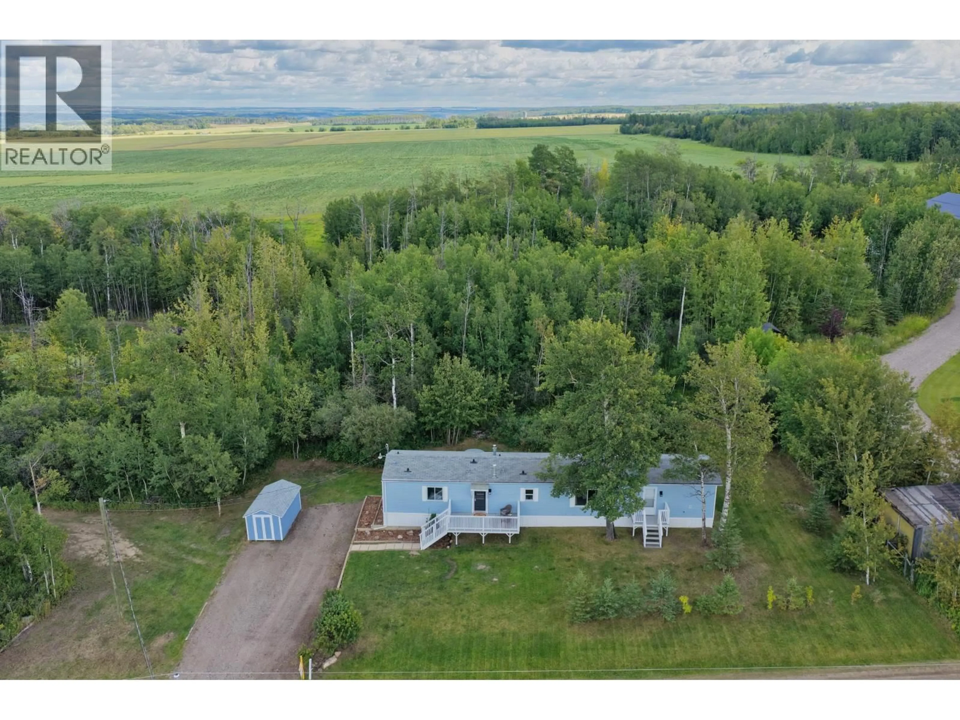 A pic from outside/outdoor area/front of a property/back of a property/a pic from drone, unknown for 11075 257 ROAD, Fort St. John British Columbia V1J8C2