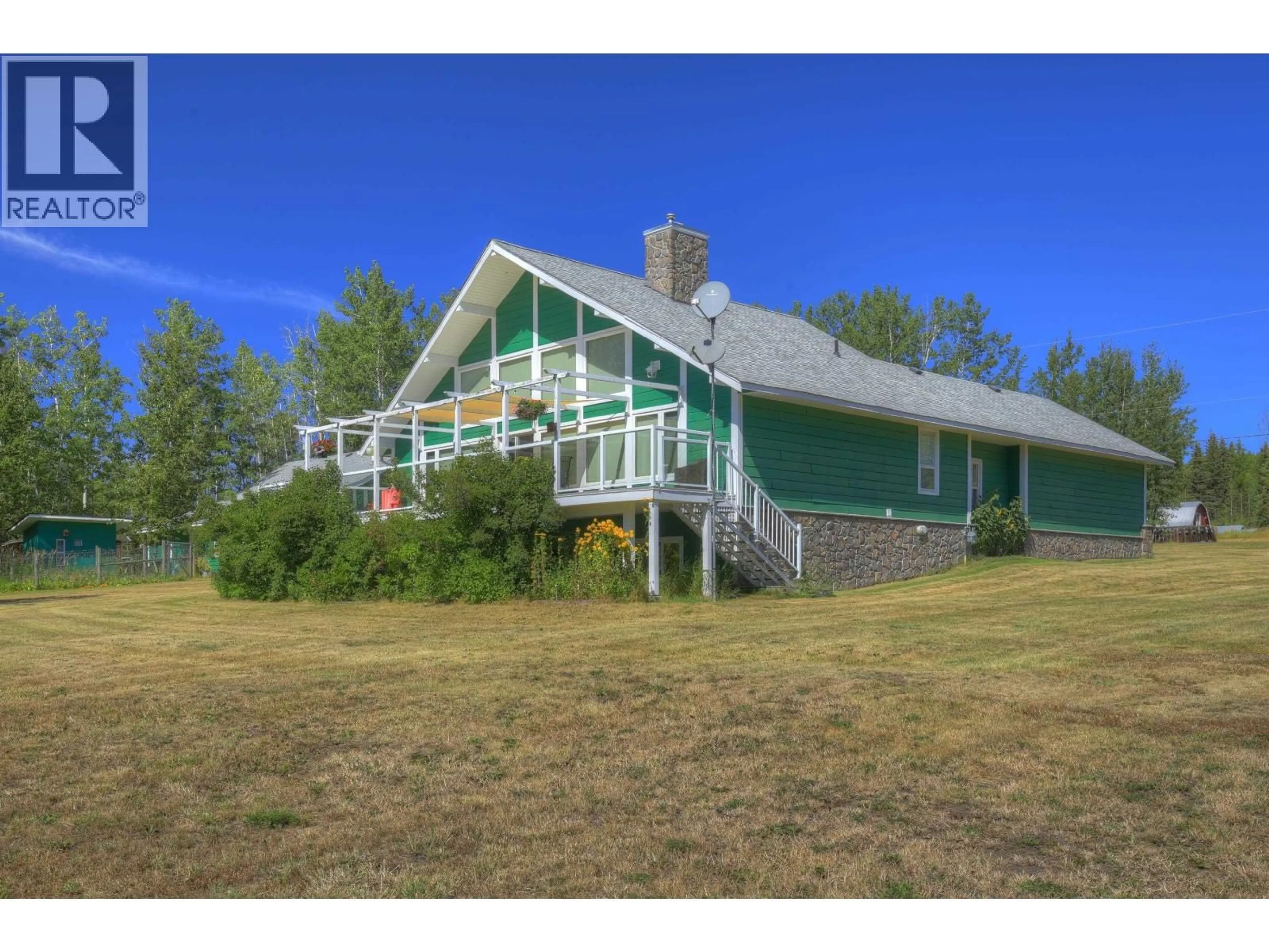 A pic from outside/outdoor area/front of a property/back of a property/a pic from drone, water/lake/river/ocean view for 3812 BRANCH DRIVE, 150 Mile House British Columbia V0K2G0