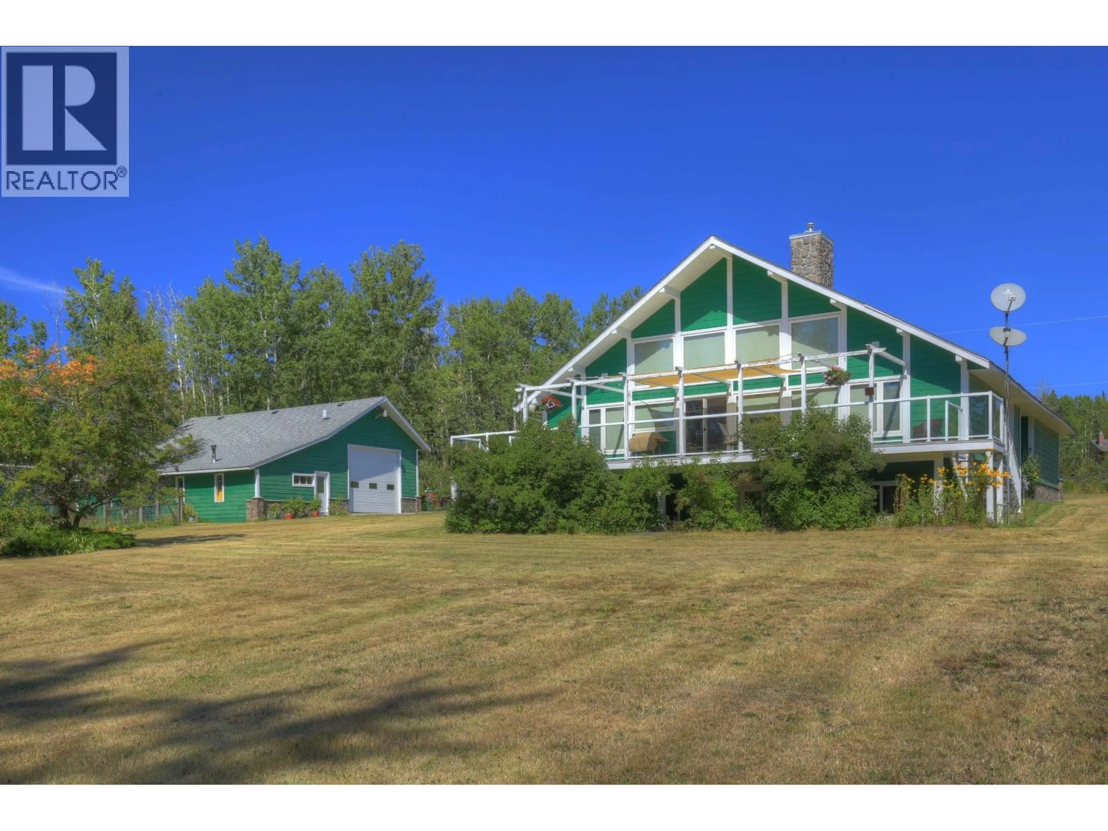 A pic from outside/outdoor area/front of a property/back of a property/a pic from drone, water/lake/river/ocean view for 3812 BRANCH DRIVE, 150 Mile House British Columbia V0K2G0