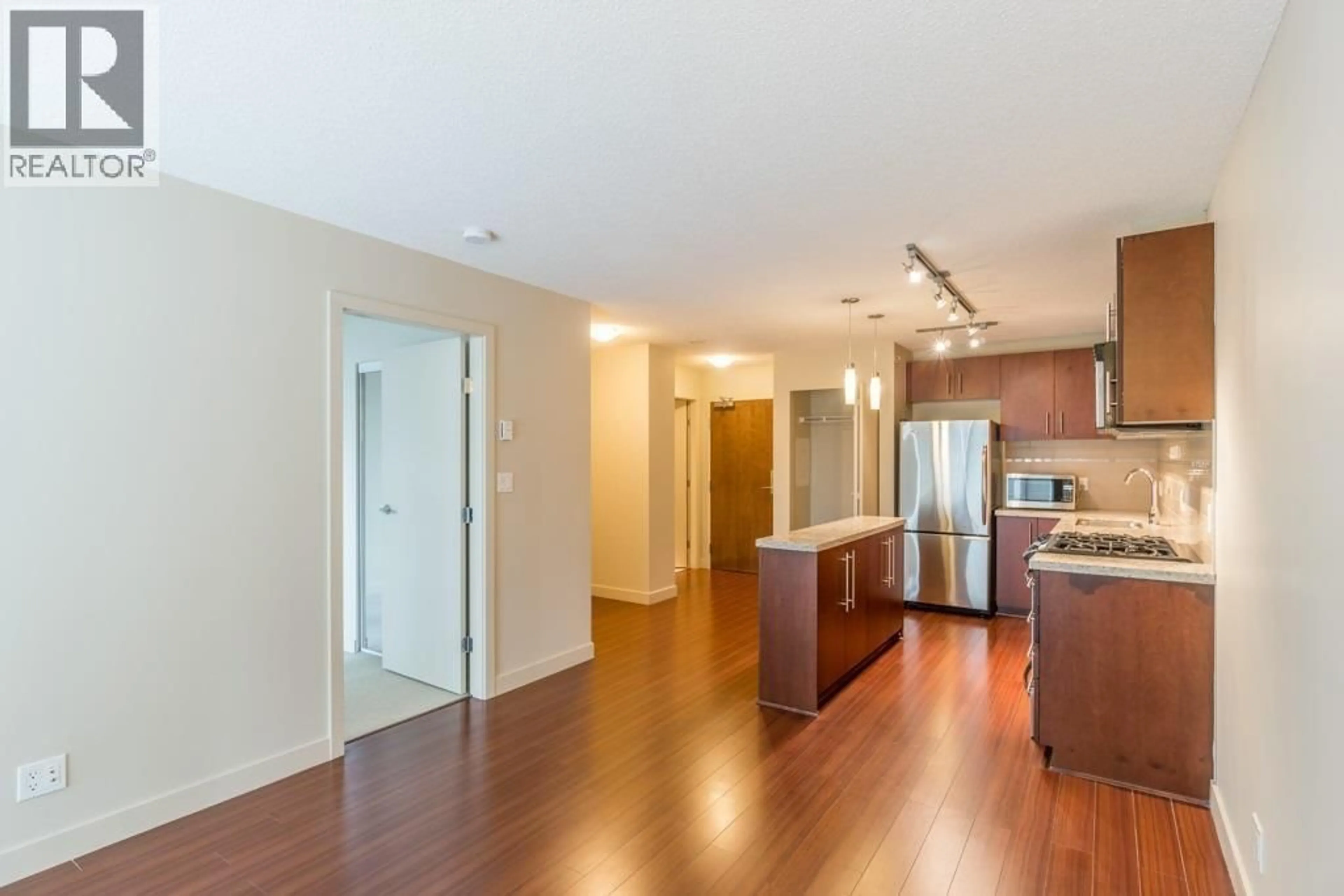 Open concept kitchen, wood/laminate floor for 1202 - 8288 LANSDOWNE ROAD, Richmond British Columbia V6X0B3