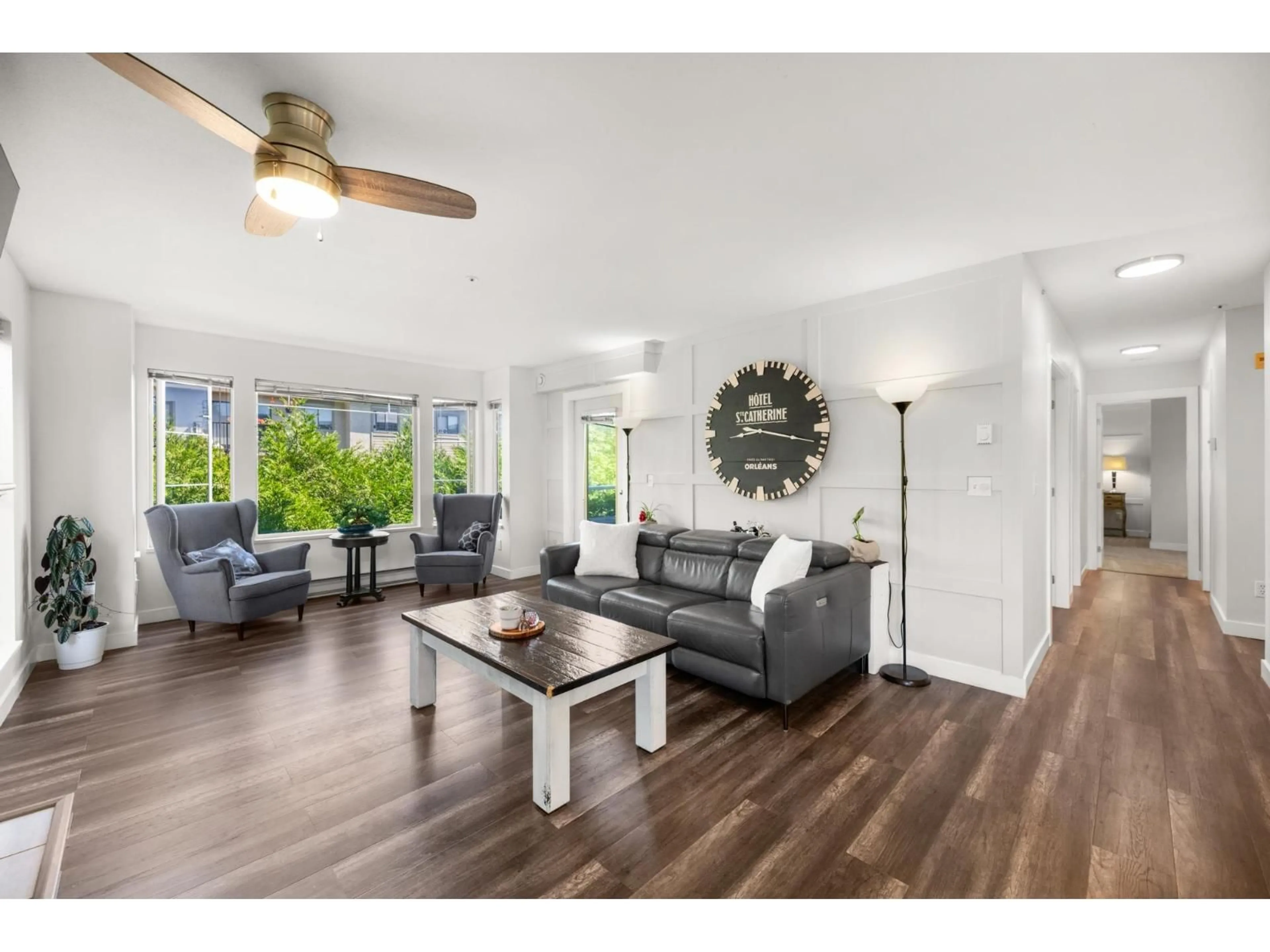 Living room with furniture, wood/laminate floor for 207 - 20350 54, Langley British Columbia V3A8J4