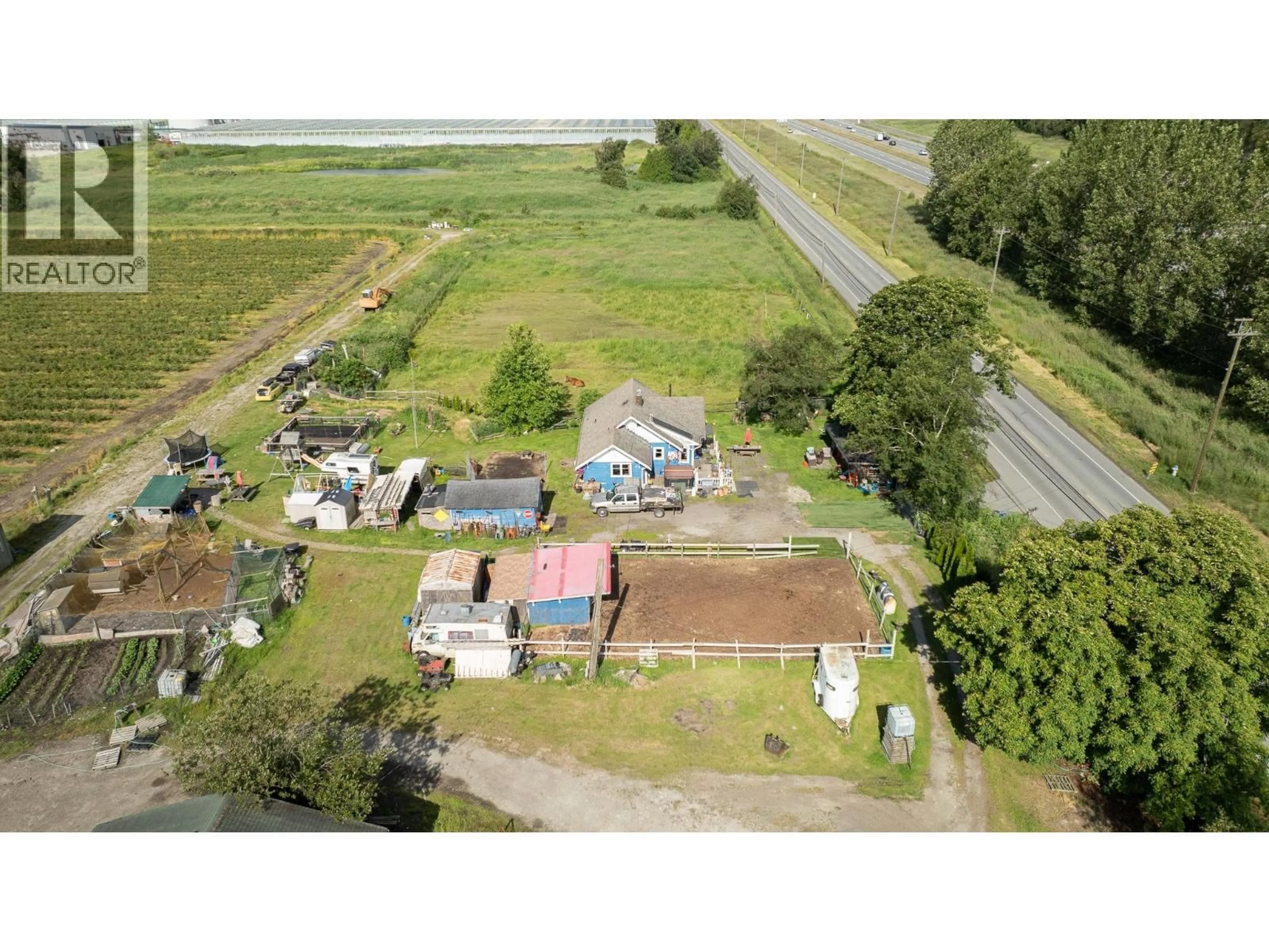 A pic from outside/outdoor area/front of a property/back of a property/a pic from drone, street for 8442 LADNER TRUNK ROAD, Delta British Columbia V4K3N3