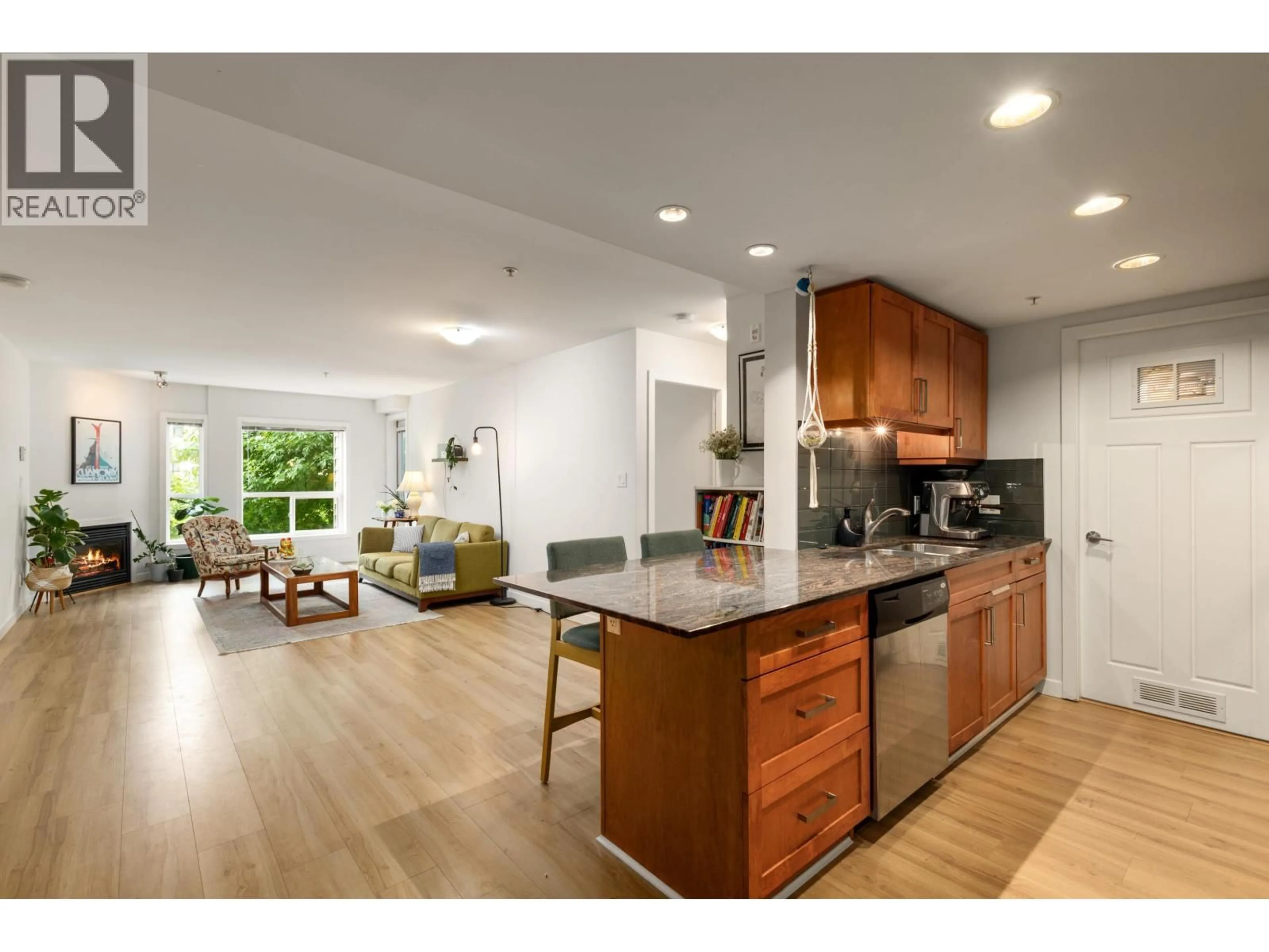 Open concept kitchen, wood/laminate floor for 204 - 1212 MAIN STREET, Squamish British Columbia V8B0S1