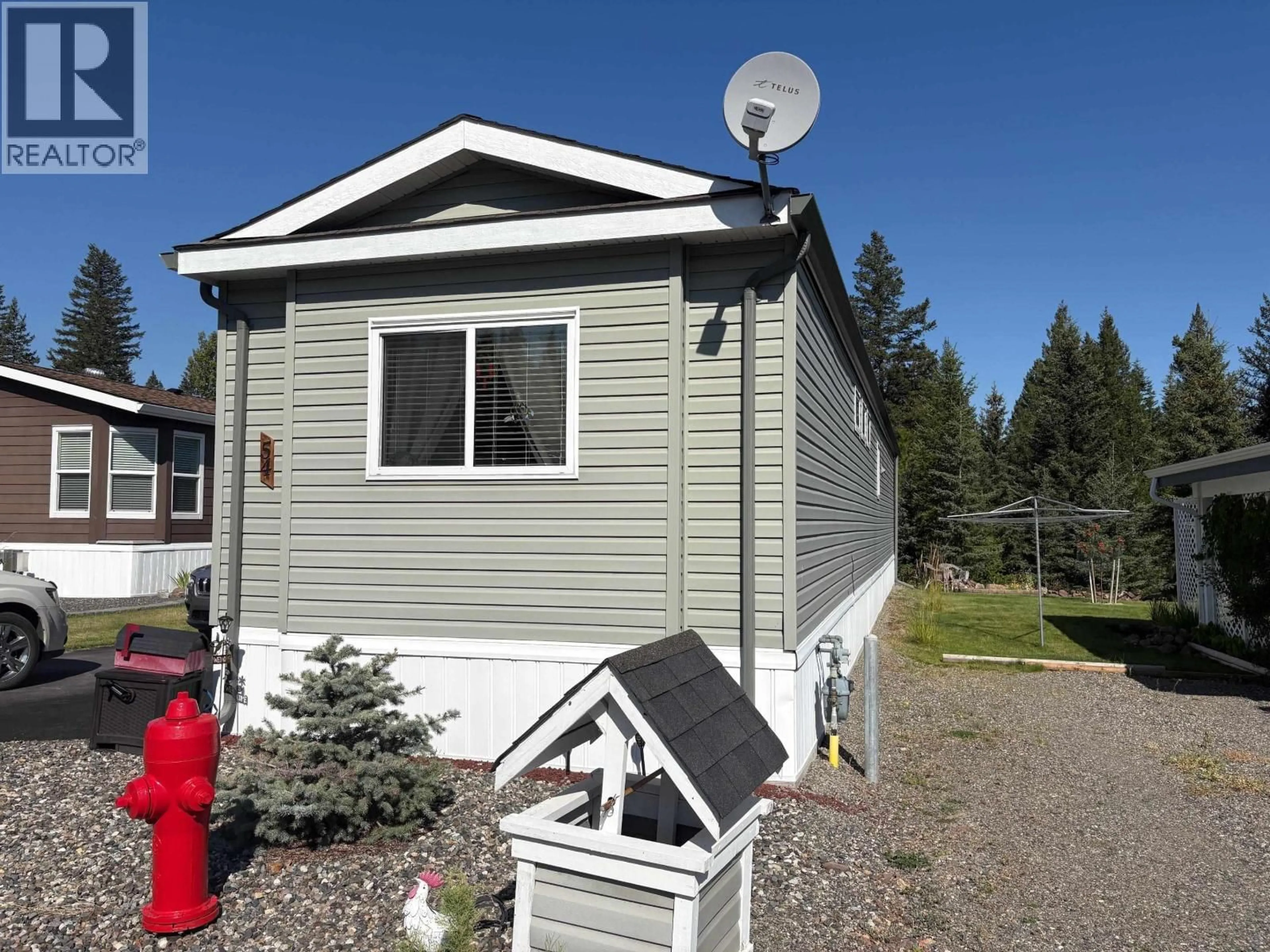 Home with vinyl exterior material, street for 54 - 208 8TH STREET, 100 Mile House British Columbia V0K2E3