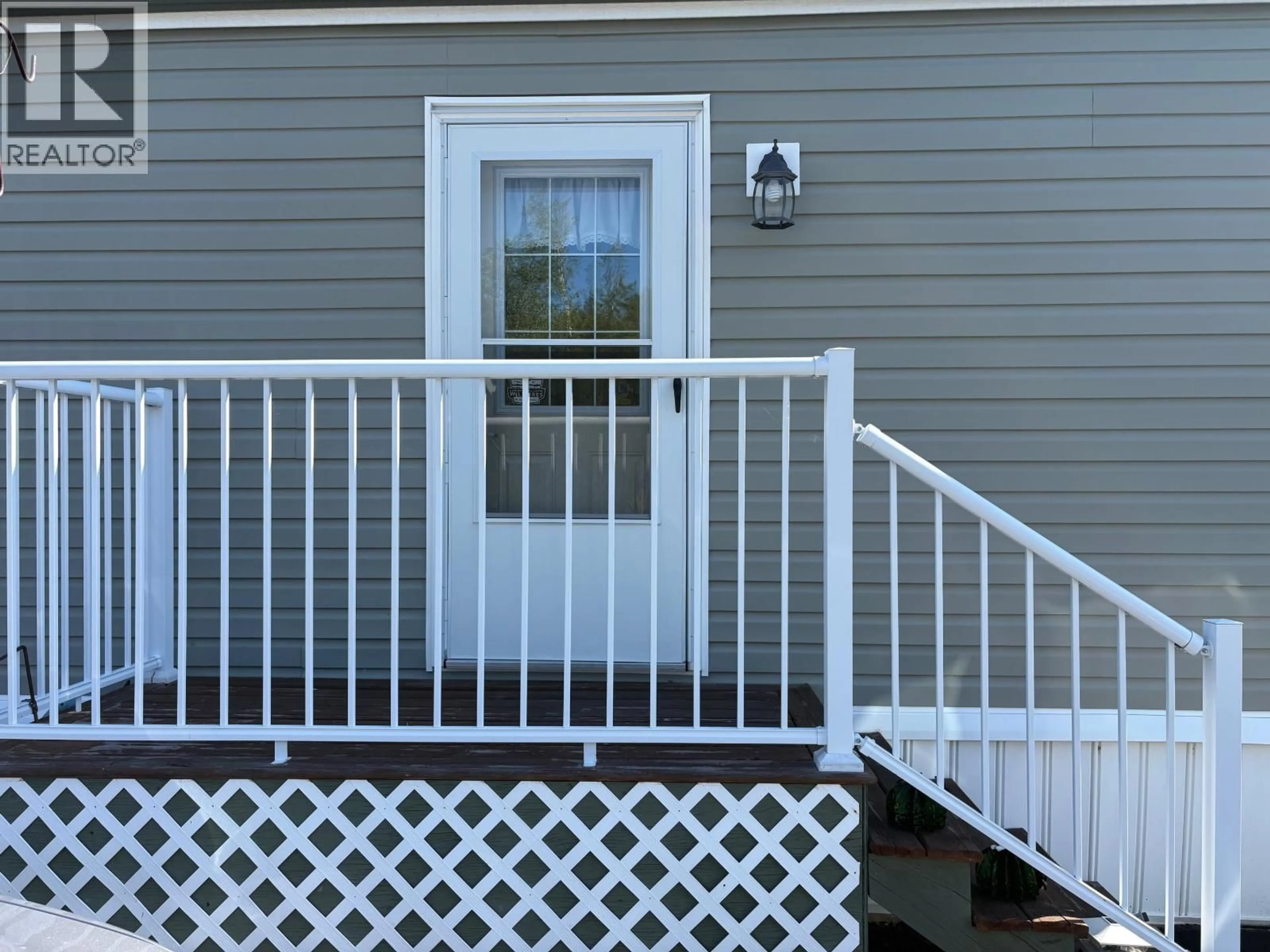 Home with vinyl exterior material, street for 54 - 208 8TH STREET, 100 Mile House British Columbia V0K2E3