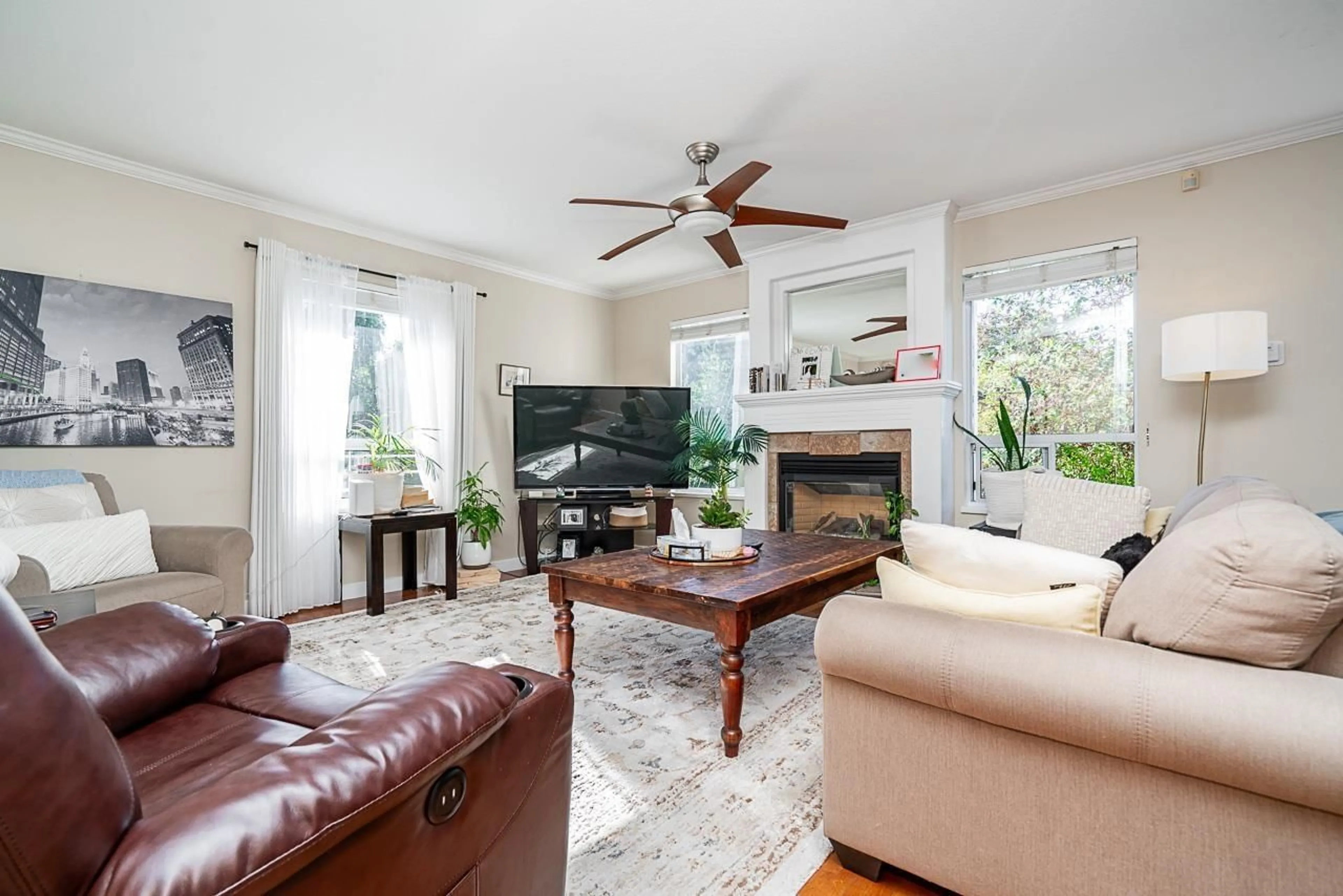 Living room with furniture, wood/laminate floor for 16143 9, Surrey British Columbia V4A8R4