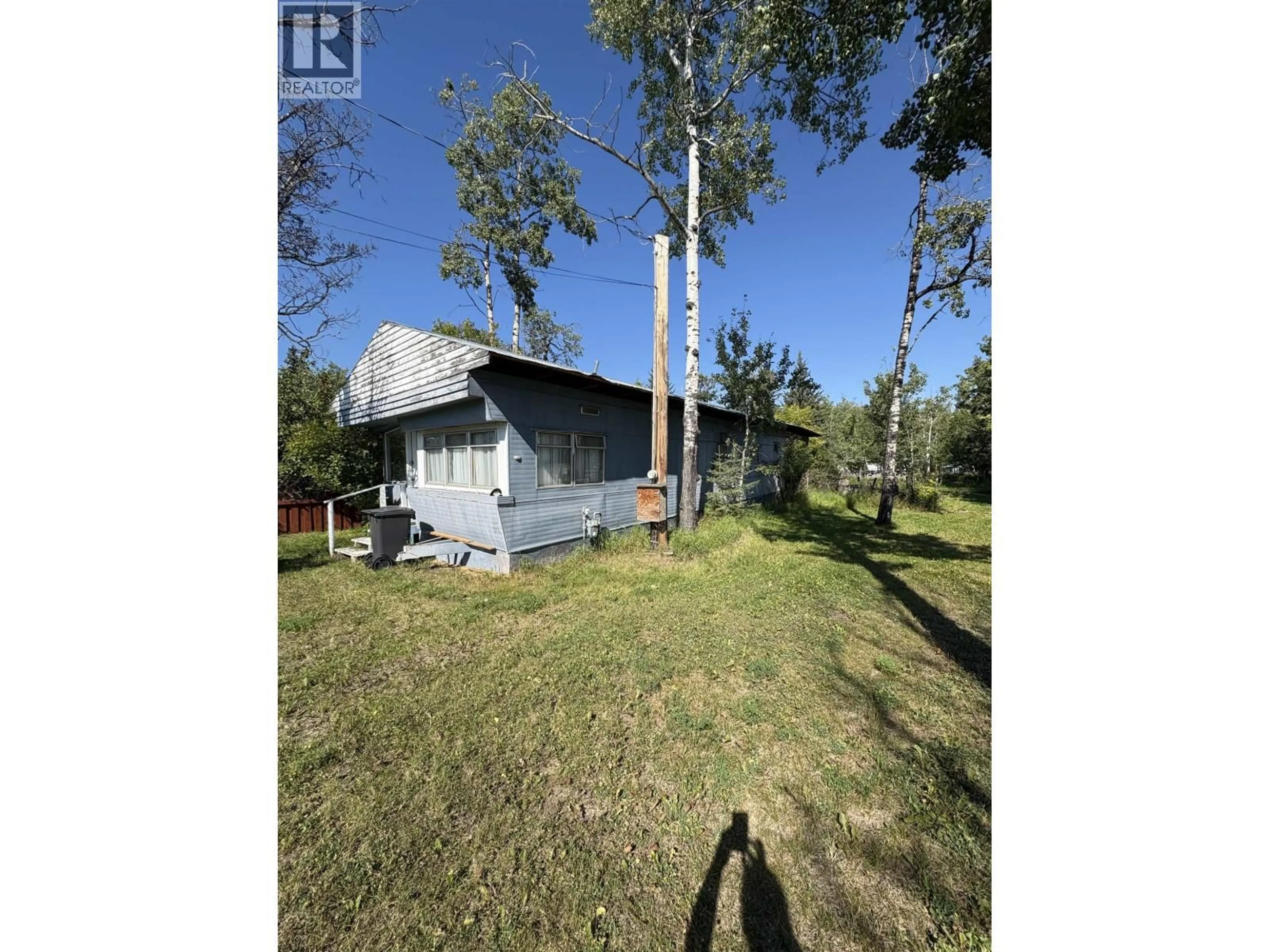 A pic from outside/outdoor area/front of a property/back of a property/a pic from drone, forest/trees view for 10105 PAQUETTE AVENUE, Hudsons Hope British Columbia V0C1V0